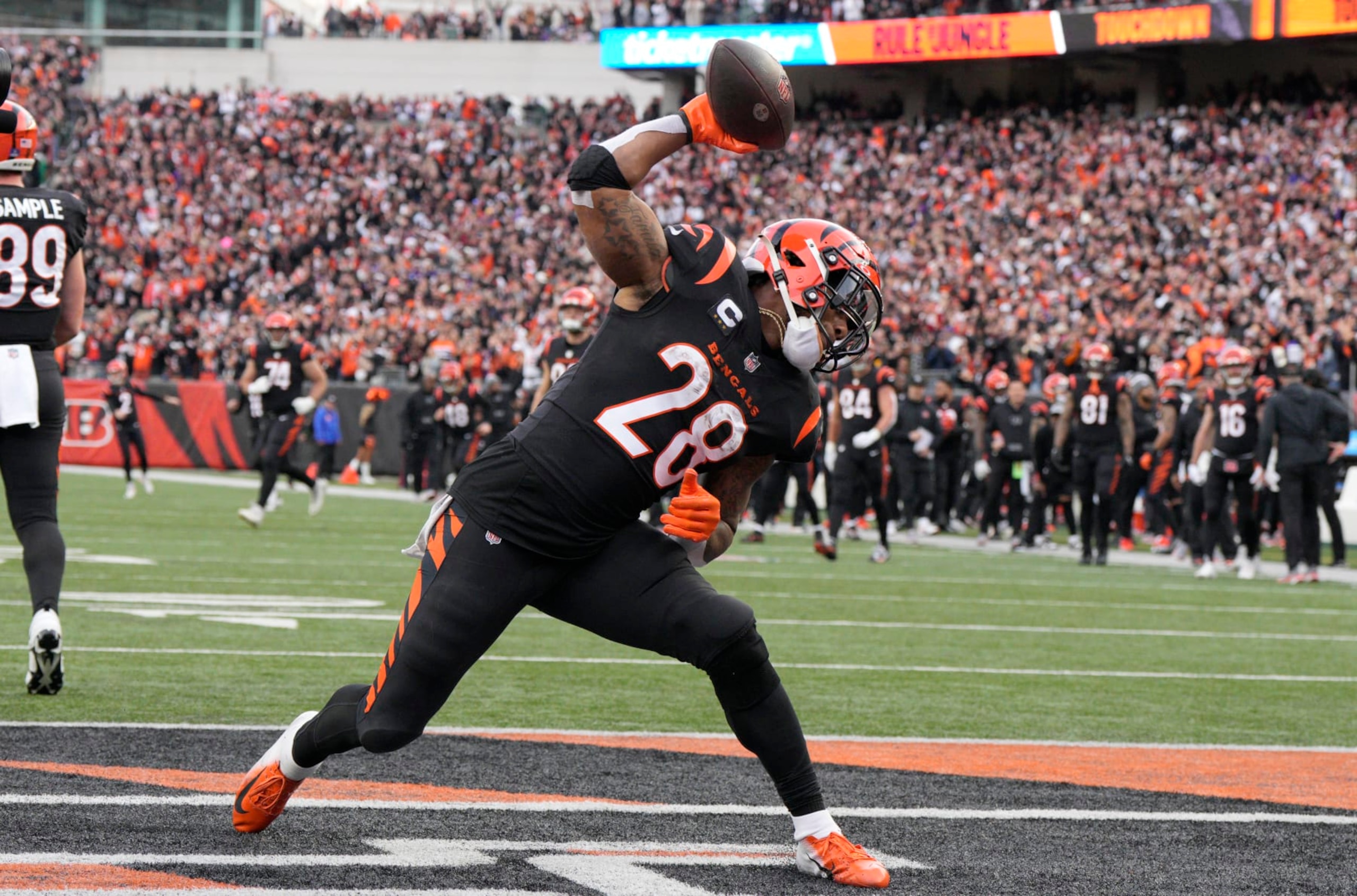 CINCINNATI, OHIO - DECEMBER 16: Joe Mixon #28 of the Cincinnati Bengals celebrates after scoring a touchdown in the fourth quarter of the game against the Minnesota Vikings at Paycor Stadium on December 16, 2023 in Cincinnati, Ohio. (Photo by Jeff Dean/Getty Images)