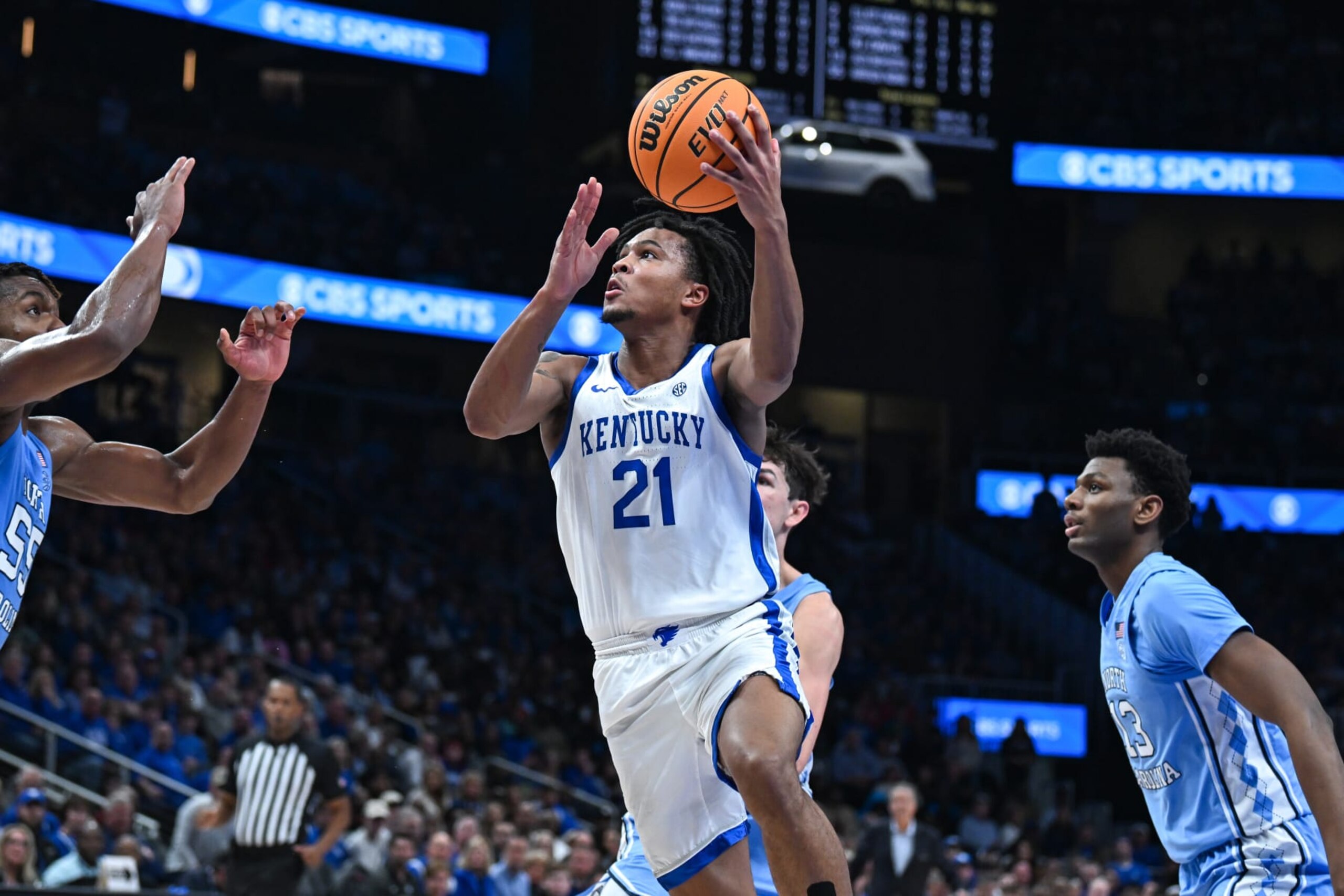 ATLANTA, GA  DECEMBER 16:  Kentucky guard D.J. Wagner (21) drives to the basket during the CBS Sports Classic college basketball game between the Kentucky Wildcats and the North Carolina Tar Heels on December 16th, 2023 at State Farm Arena in Atlanta, GA.  (Photo by Rich von Biberstein/Icon Sportswire via Getty Images)