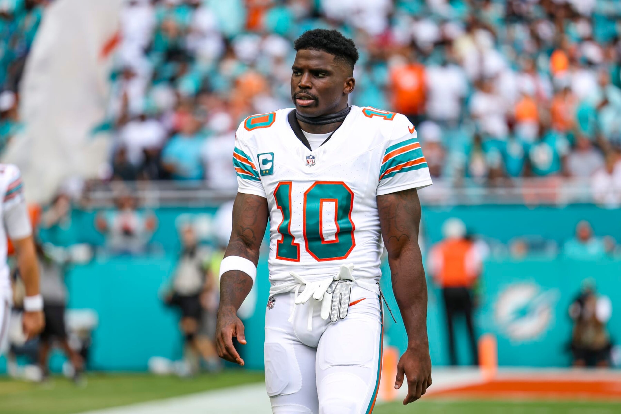 MIAMI GARDENS, FL - OCTOBER 29: Tyreek Hill #10 of the Miami Dolphins looks on from the field prior to an NFL football game against the New England Patriots at Hard Rock Stadium on October 29, 2023 in Miami Gardens, Florida. (Photo by Perry Knotts/Getty Images)