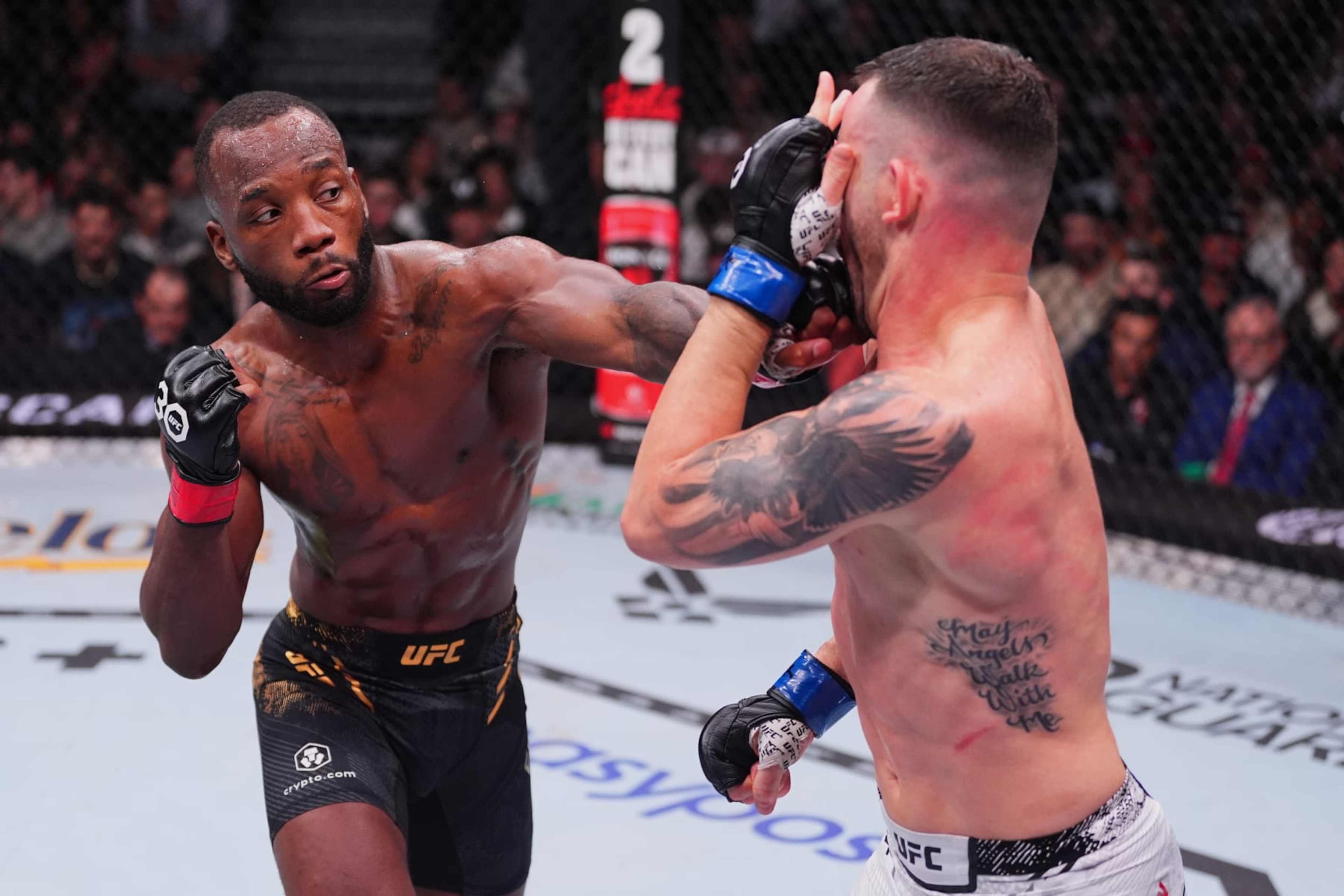 LAS VEGAS, NEVADA - DECEMBER 16: (L-R) Leon Edwards of Jamaica punches Colby Covington in the UFC welterweight championship fight during the UFC 296 event at T-Mobile Arena on December 16, 2023 in Las Vegas, Nevada. (Photo by Jeff Bottari/Zuffa LLC via Getty Images) LAS VEGAS, NEVADA - DECEMBER 16: (L-R) Leon Edwards of Jamaica punches Colby Covington in the UFC welterweight championship fight during the UFC 296 event at T-Mobile Arena on December 16, 2023 in Las Vegas, Nevada. (Photo by Jeff Bottari/Zuffa LLC via Getty Images)