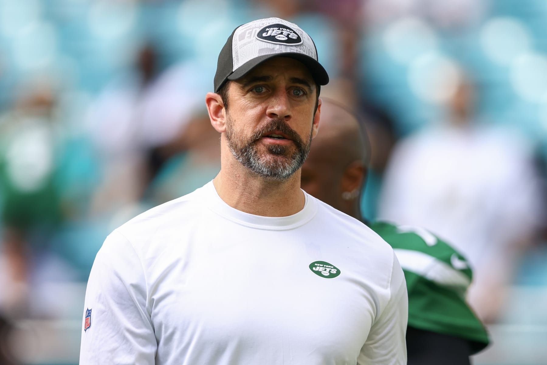 MIAMI GARDENS, FLORIDA - DECEMBER 17: Aaron Rodgers #8 of the New York Jets looks on prior to a game against the Miami Dolphins at Hard Rock Stadium on December 17, 2023 in Miami Gardens, Florida. (Photo by Megan Briggs/Getty Images)