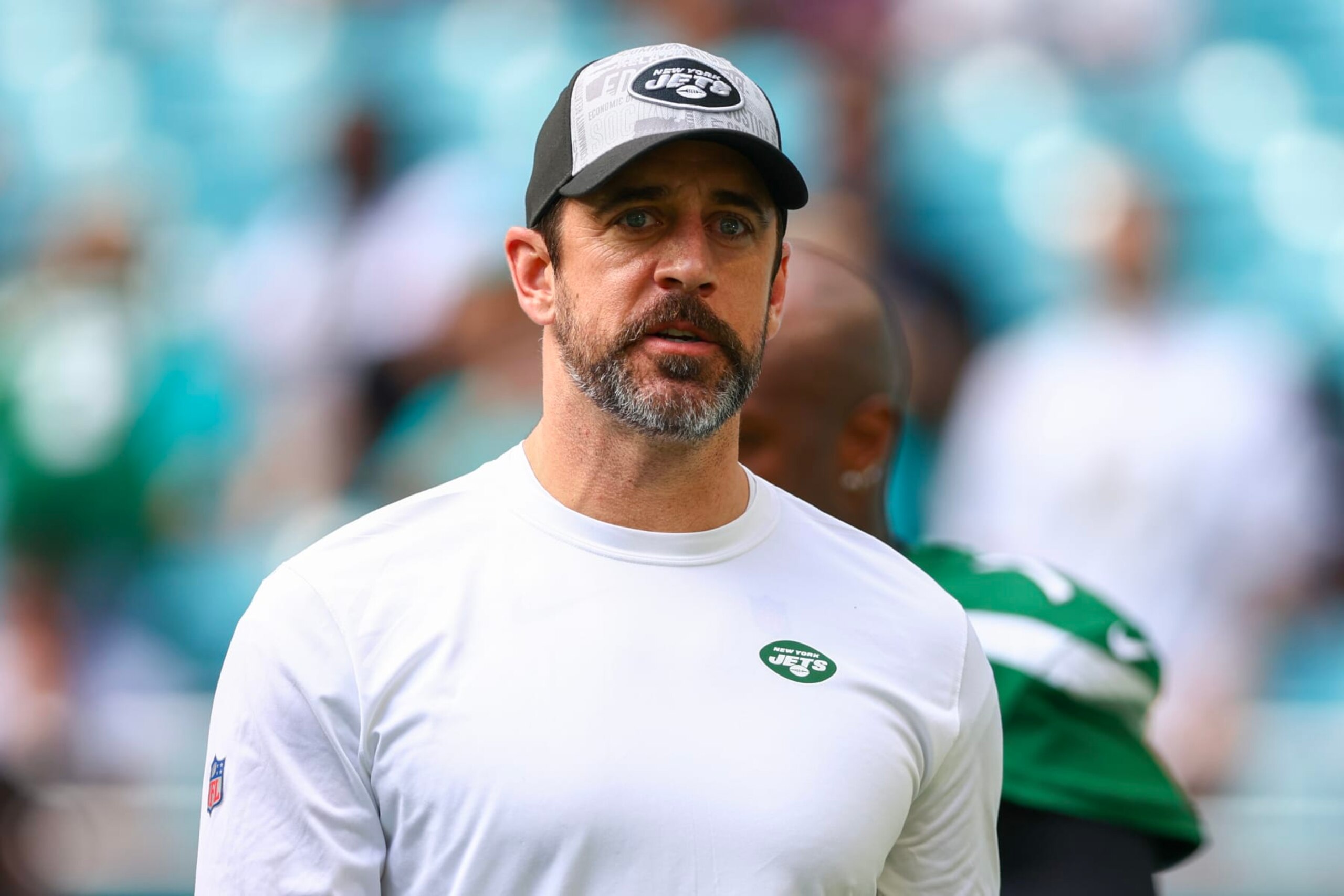 MIAMI GARDENS, FLORIDA - DECEMBER 17: Aaron Rodgers #8 of the New York Jets looks on prior to a game against the Miami Dolphins at Hard Rock Stadium on December 17, 2023 in Miami Gardens, Florida. (Photo by Megan Briggs/Getty Images)