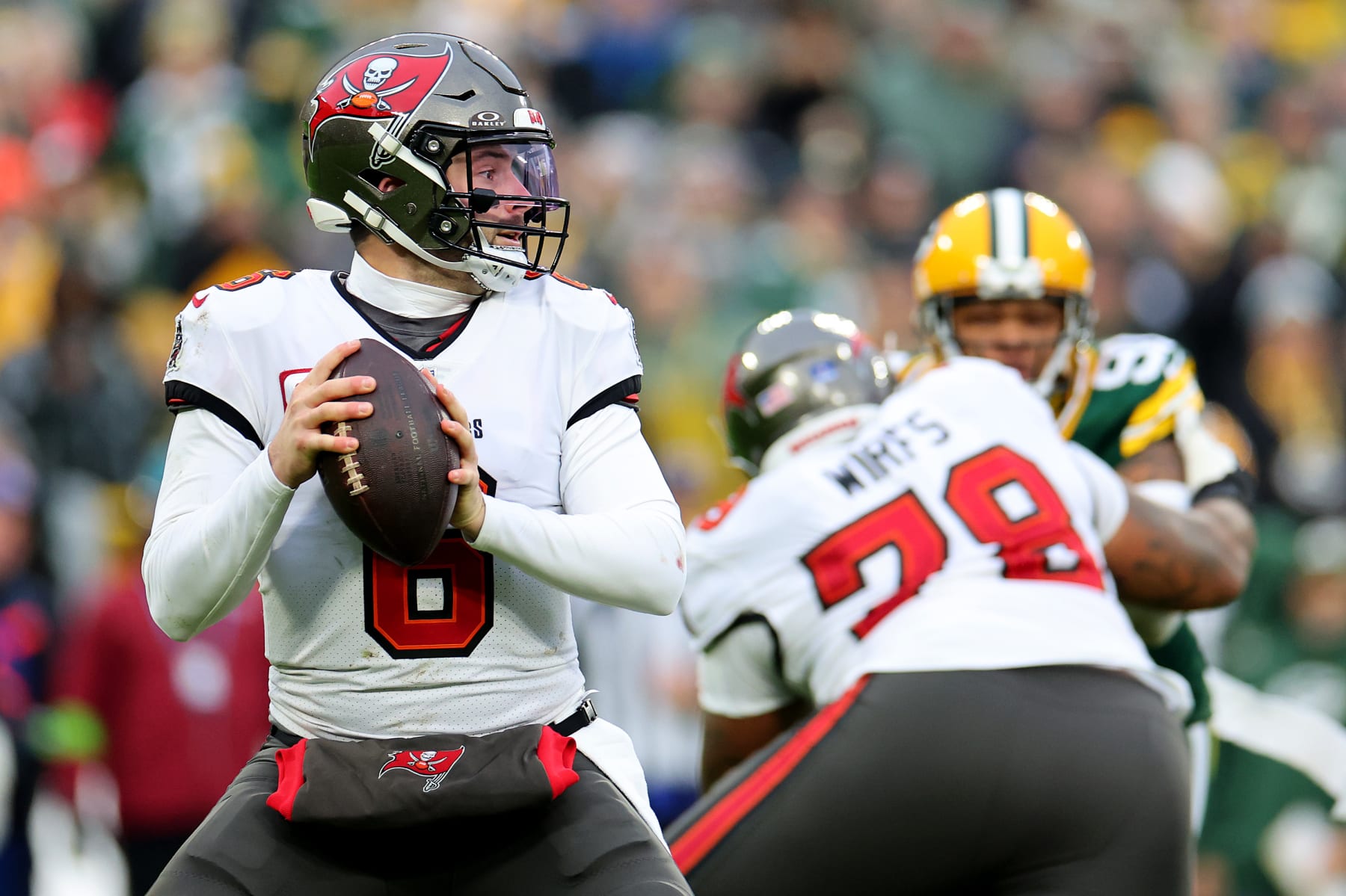 GREEN BAY, WISCONSIN - DECEMBER 17: Baker Mayfield #6 of the Tampa Bay Buccaneers attempts a pass during the second quarter against the Green Bay Packers at Lambeau Field on December 17, 2023 in Green Bay, Wisconsin. (Photo by Stacy Revere/Getty Images)