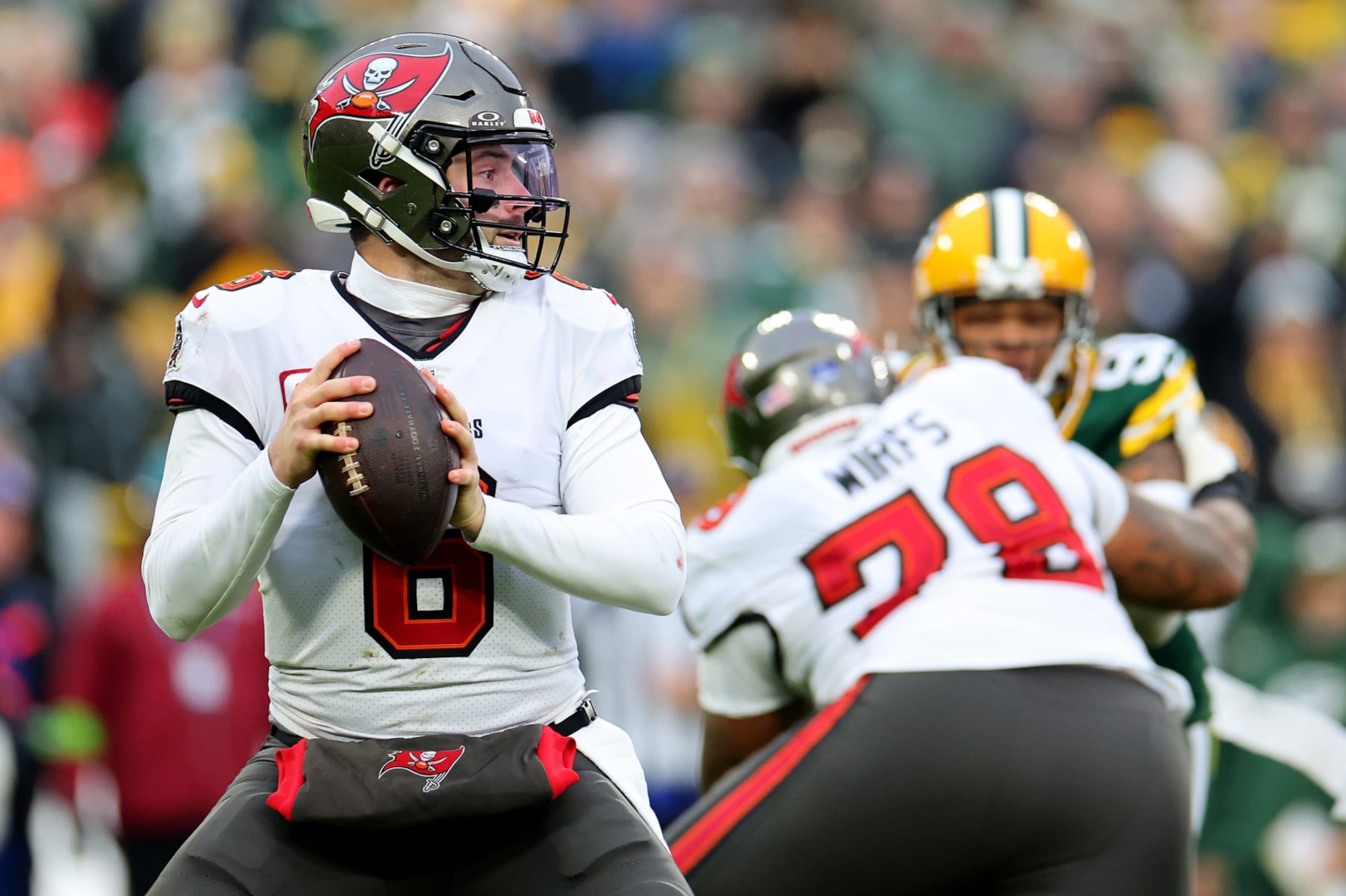 GREEN BAY, WISCONSIN - DECEMBER 17: Baker Mayfield #6 of the Tampa Bay Buccaneers attempts a pass during the second quarter against the Green Bay Packers at Lambeau Field on December 17, 2023 in Green Bay, Wisconsin. (Photo by Stacy Revere/Getty Images)