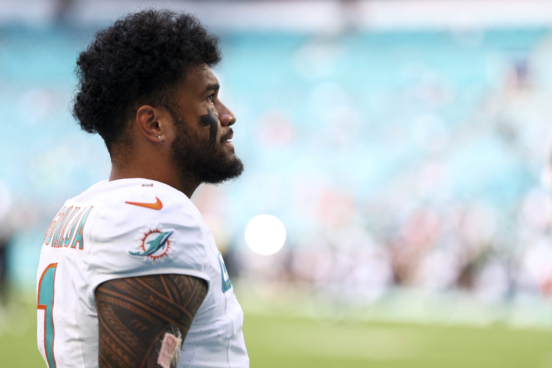 MIAMI GARDENS, FL - DECEMBER 17: Tua Tagovailoa #1 of the Miami Dolphins looks on prior to an NFL football game against the New York Jets at Hard Rock Stadium on December 17, 2023 in Miami Gardens, Florida. (Photo by Kevin Sabitus/Getty Images)