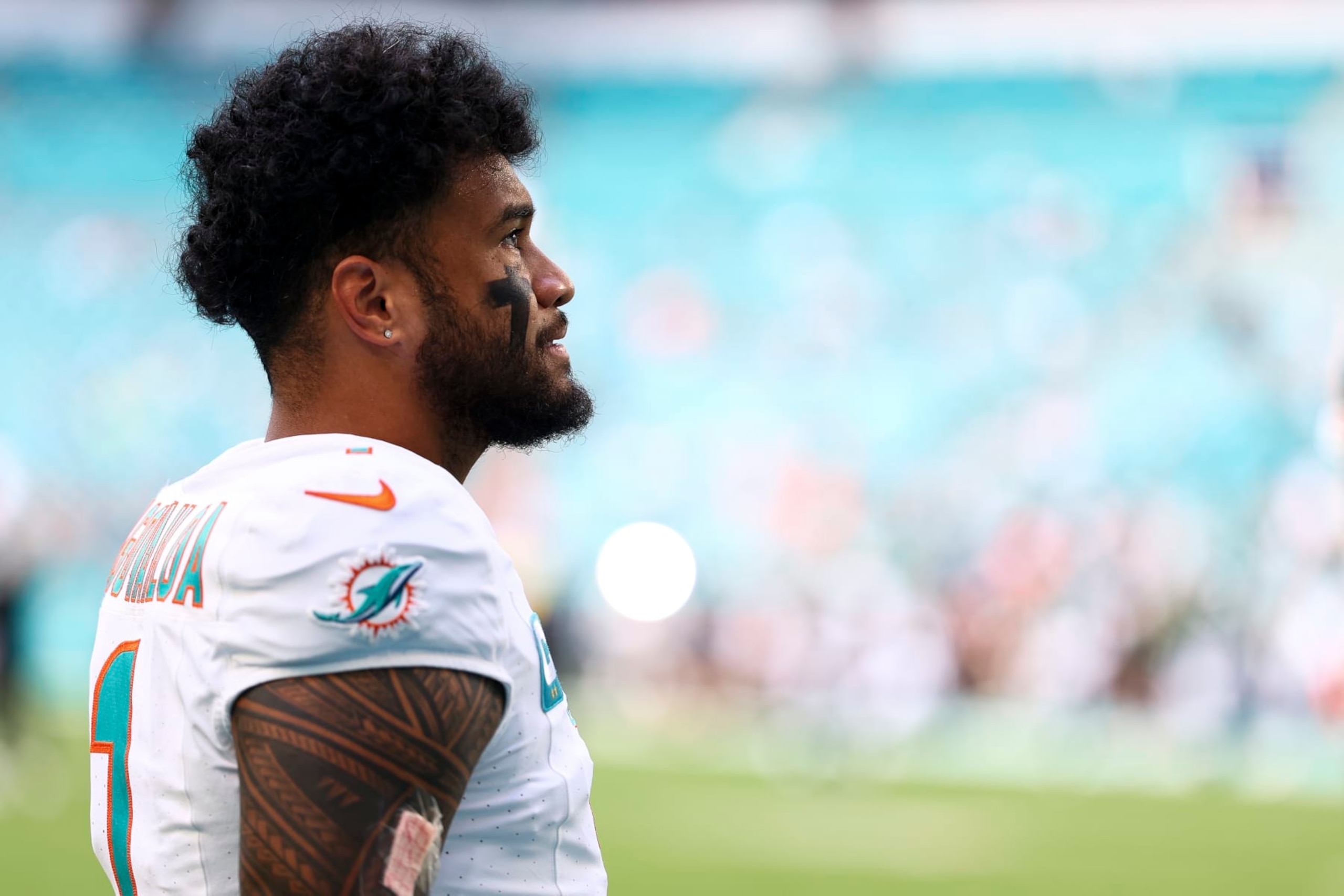 MIAMI GARDENS, FL - DECEMBER 17: Tua Tagovailoa #1 of the Miami Dolphins looks on prior to an NFL football game against the New York Jets at Hard Rock Stadium on December 17, 2023 in Miami Gardens, Florida. (Photo by Kevin Sabitus/Getty Images)