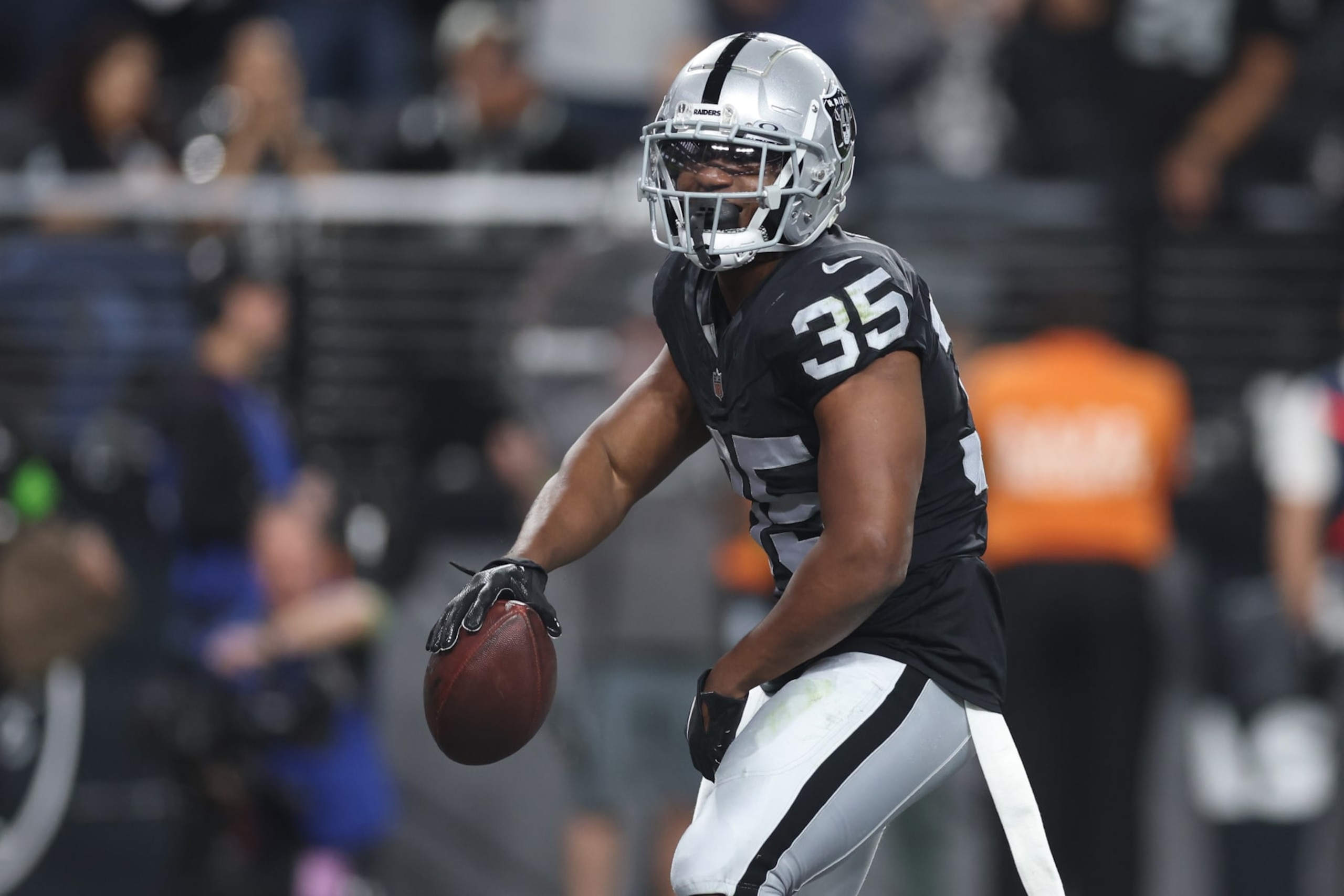 LAS VEGAS, NEVADA - DECEMBER 14: Running back Zamir White #35 of the Las Vegas Raiders celebrates after scoring a touchdown against the Los Angeles Chargers during the first quarter at Allegiant Stadium on December 14, 2023 in Las Vegas, Nevada. (Photo by Sean M. Haffey/Getty Images)