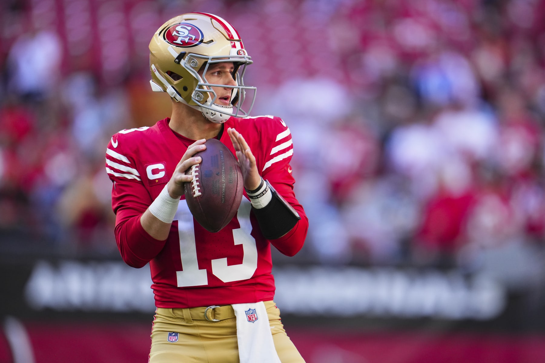 GLENDALE, AZ - DECEMBER 17: Brock Purdy #13 of the San Francisco 49ers warms up before kickoff against the Arizona Cardinals at State Farm Stadium on December 17, 2023 in Glendale, Arizona. (Photo by Cooper Neill/Getty Images)