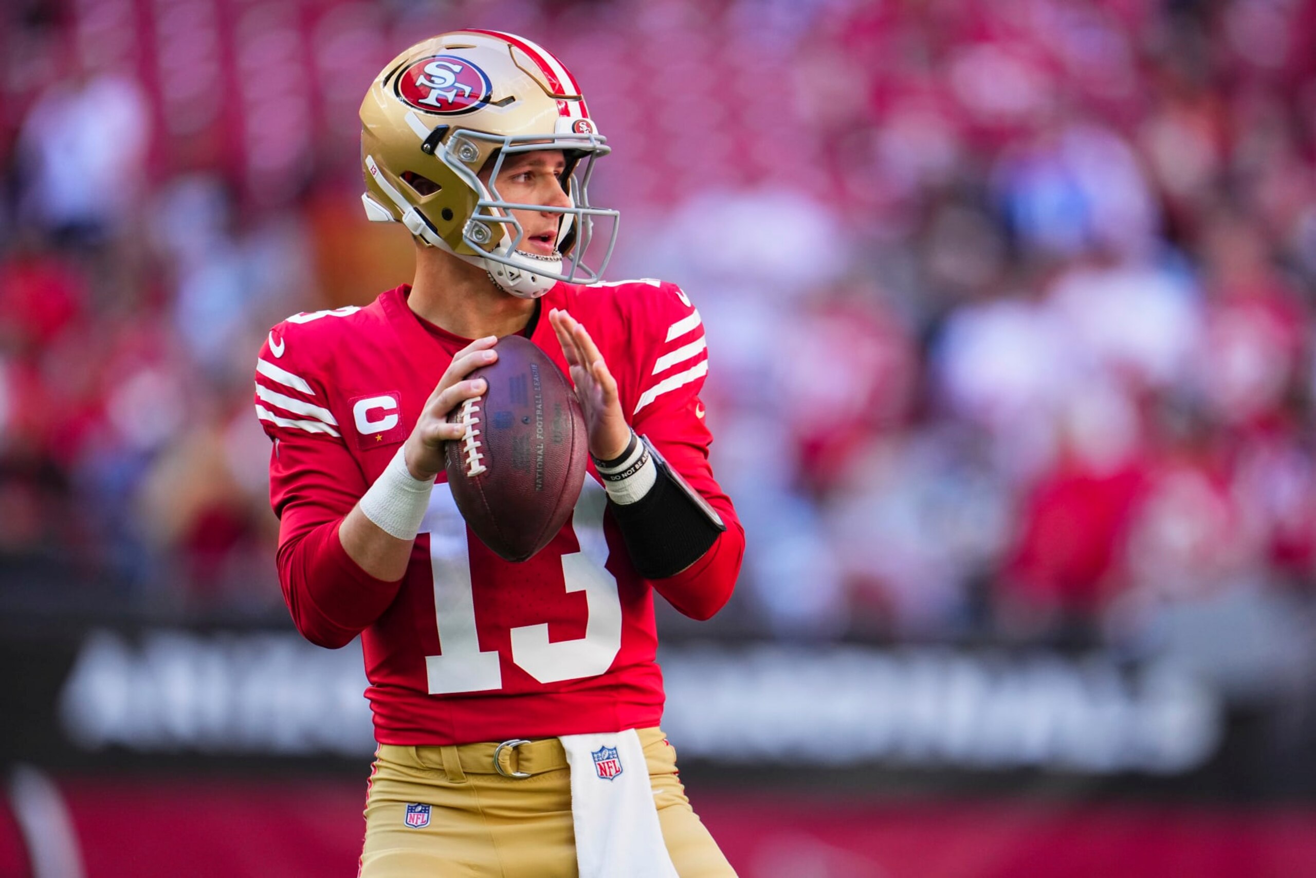 GLENDALE, AZ - DECEMBER 17: Brock Purdy #13 of the San Francisco 49ers warms up before kickoff against the Arizona Cardinals at State Farm Stadium on December 17, 2023 in Glendale, Arizona. (Photo by Cooper Neill/Getty Images)