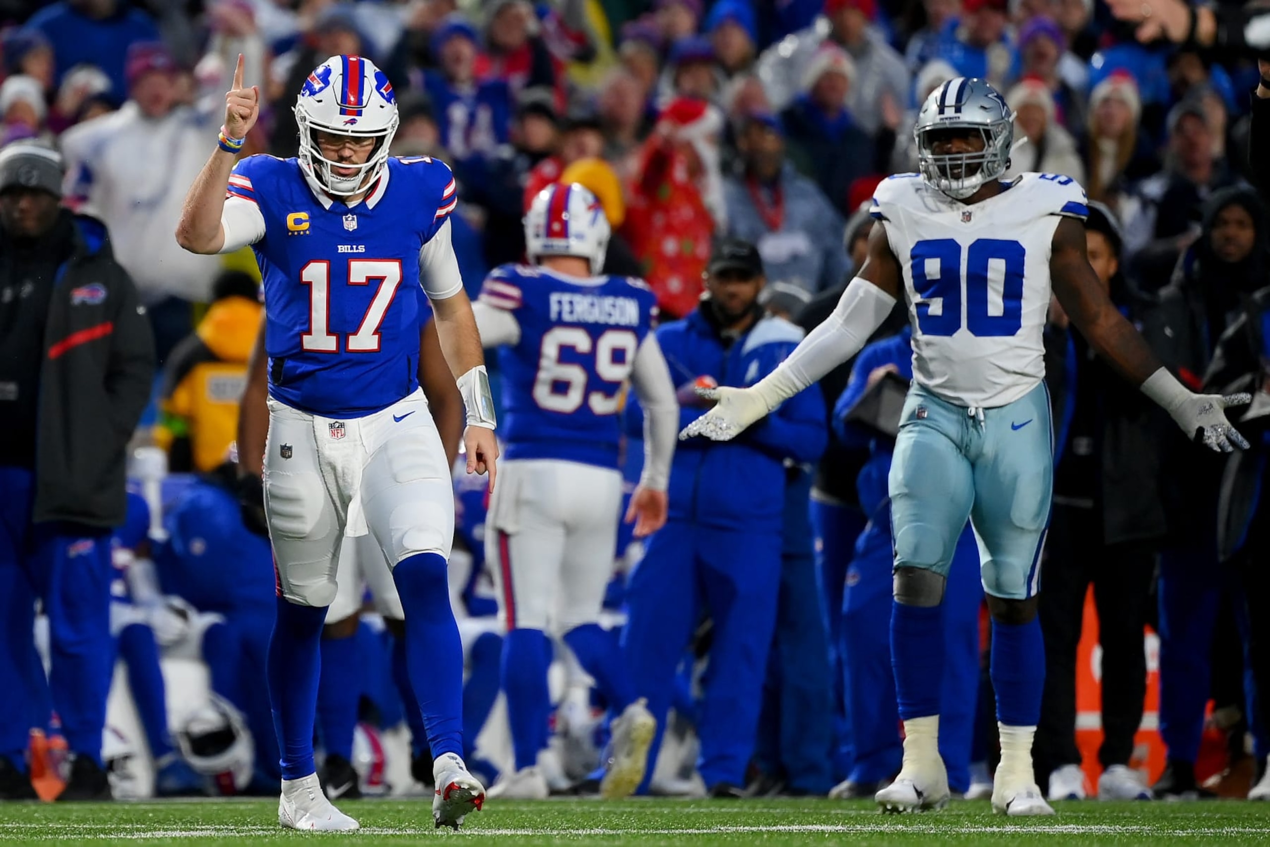 ORCHARD PARK, NEW YORK - DECEMBER 17: Josh Allen #17 of the Buffalo Bills and DeMarcus Lawrence #90 of the Dallas Cowboys react after Dallas is called for roughing the passer, resulting in a first down for Buffalo, during the first quarter at Highmark Stadium on December 17, 2023 in Orchard Park, New York. (Photo by Rich Barnes/Getty Images)