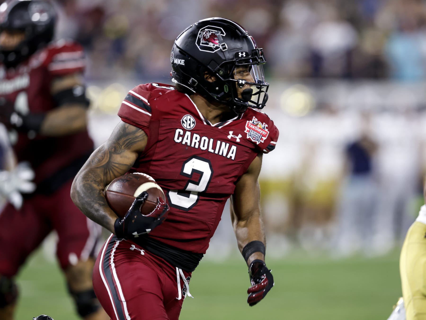 JACKSONVILLE, FL - DECEMBER 30: Wide Receiver Antwane Wells Jr. #3 of the South Carolina Gamecocks on an end around running play during the game against the Notre Dame Fighting IrishSouth Carolina Gamecocks at the 78th annual TaxSlayer Gator Bowl at TIAA Bank Field on January 2, 2021 in Jacksonvile, Florida. The Fighting Irish defeated The Gamecocks 45 to 38. (Photo by Don Juan Moore/Getty Images)
