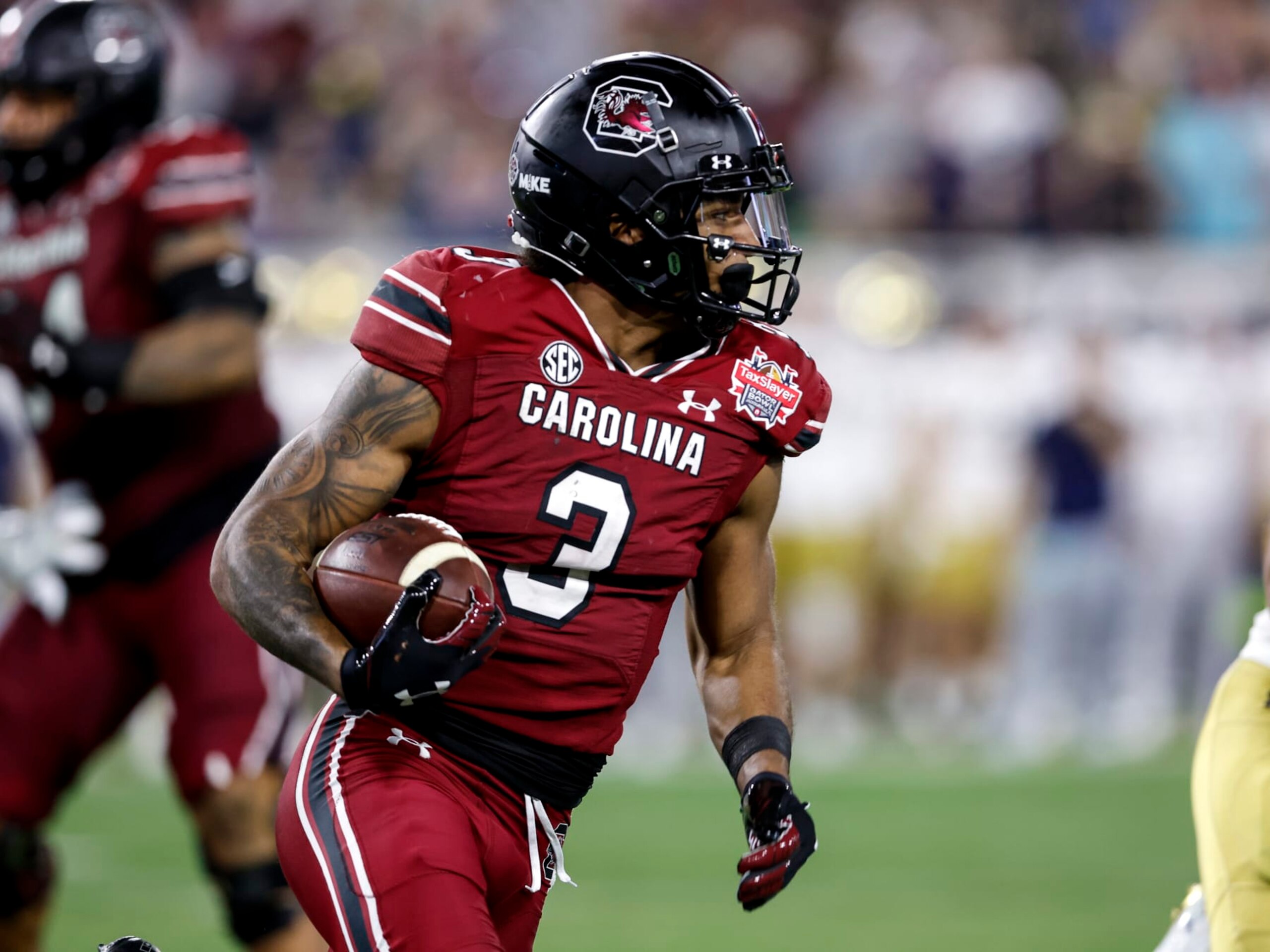 JACKSONVILLE, FL - DECEMBER 30: Wide Receiver Antwane Wells Jr. #3 of the South Carolina Gamecocks on an end around running play during the game against the Notre Dame Fighting IrishSouth Carolina Gamecocks at the 78th annual TaxSlayer Gator Bowl at TIAA Bank Field on January 2, 2021 in Jacksonvile, Florida. The Fighting Irish defeated The Gamecocks 45 to 38. (Photo by Don Juan Moore/Getty Images) JACKSONVILLE, FL - DECEMBER 30: Wide Receiver Antwane Wells Jr. #3 of the South Carolina Gamecocks on an end around running play during the game against the Notre Dame Fighting IrishSouth Carolina Gamecocks at the 78th annual TaxSlayer Gator Bowl at TIAA Bank Field on January 2, 2021 in Jacksonvile, Florida. The Fighting Irish defeated The Gamecocks 45 to 38. (Photo by Don Juan Moore/Getty Images)