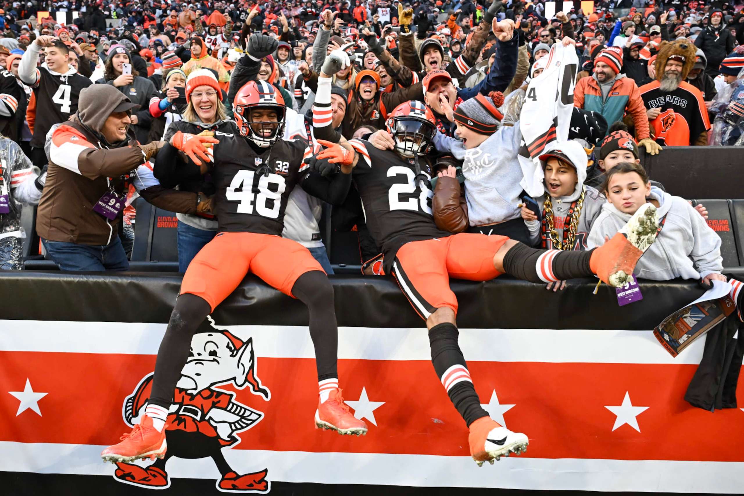 CLEVELAND, OHIO - DECEMBER 17: Tanner McCalister #48 and Mike Ford #28 of the Cleveland Browns celebrate after a fourth quarter interception to win 20-17 over the Chicago Bears at Cleveland Browns Stadium on December 17, 2023 in Cleveland, Ohio. (Photo by Nick Cammett/Getty Images)