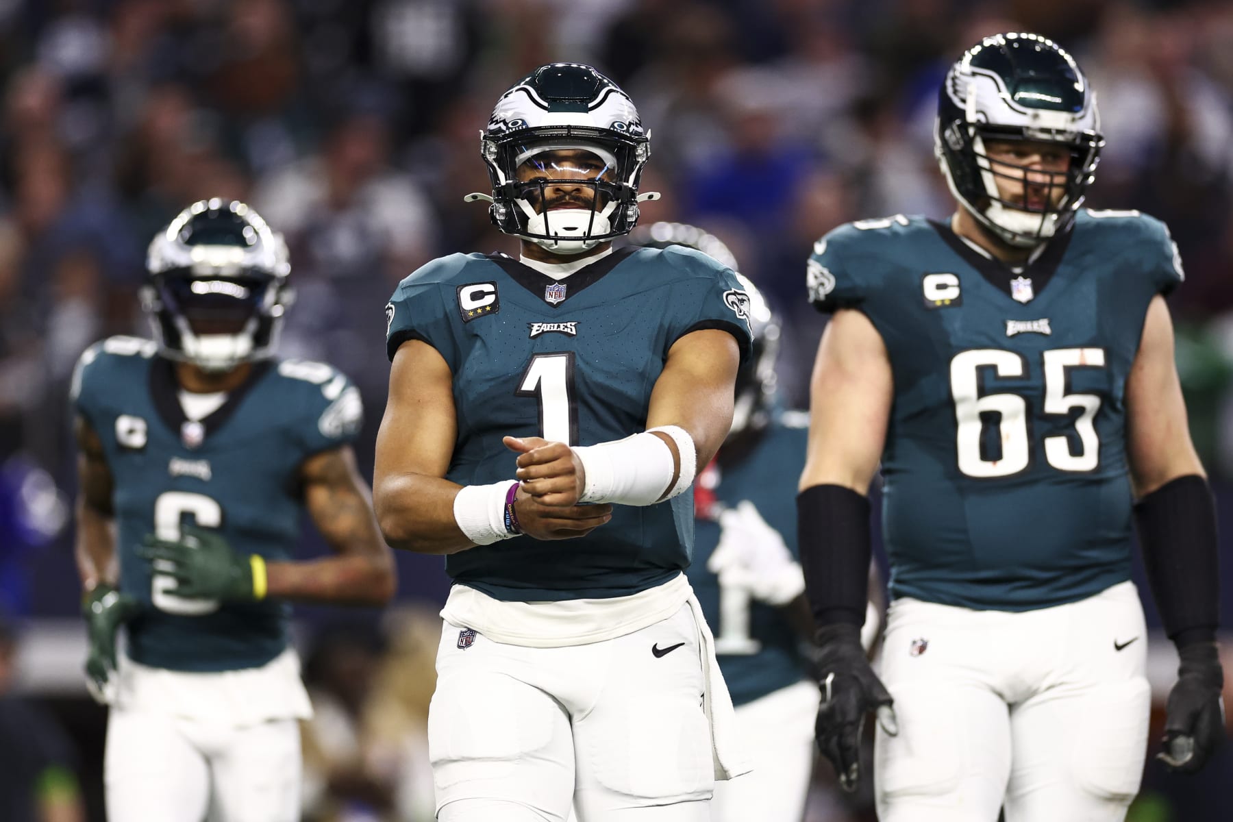 ARLINGTON, TX - DECEMBER 10: Jalen Hurts #1 of the Philadelphia Eagles reads from his play sheet during an NFL football game against the Dallas Cowboys at AT&T Stadium on December 10, 2023 in Arlington, Texas. (Photo by Kevin Sabitus/Getty Images)