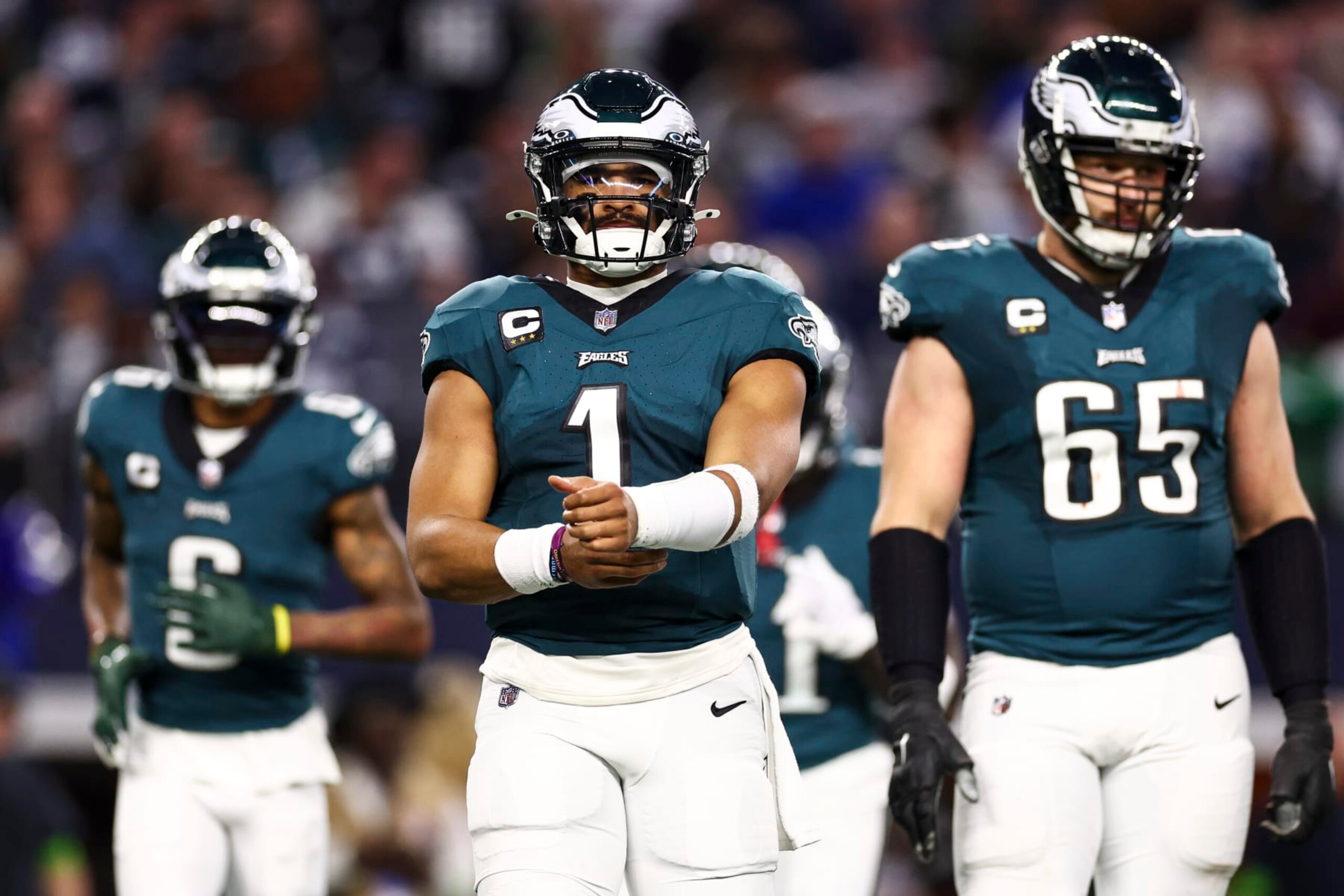 ARLINGTON, TX - DECEMBER 10: Jalen Hurts #1 of the Philadelphia Eagles reads from his play sheet during an NFL football game against the Dallas Cowboys at AT&T Stadium on December 10, 2023 in Arlington, Texas. (Photo by Kevin Sabitus/Getty Images)