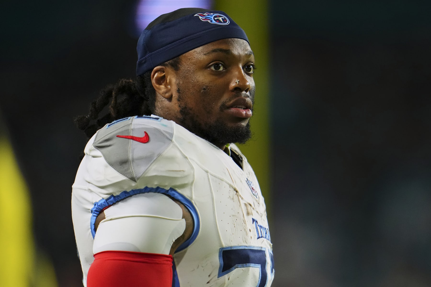 MIAMI GARDENS, FL - DECEMBER 11: Derrick Henry #22 of the Tennessee Titans looks on from the sideline against the Miami Dolphins during the first half at Hard Rock Stadium on December 11, 2023 in Miami Gardens, Florida. (Photo by Cooper Neill/Getty Images)