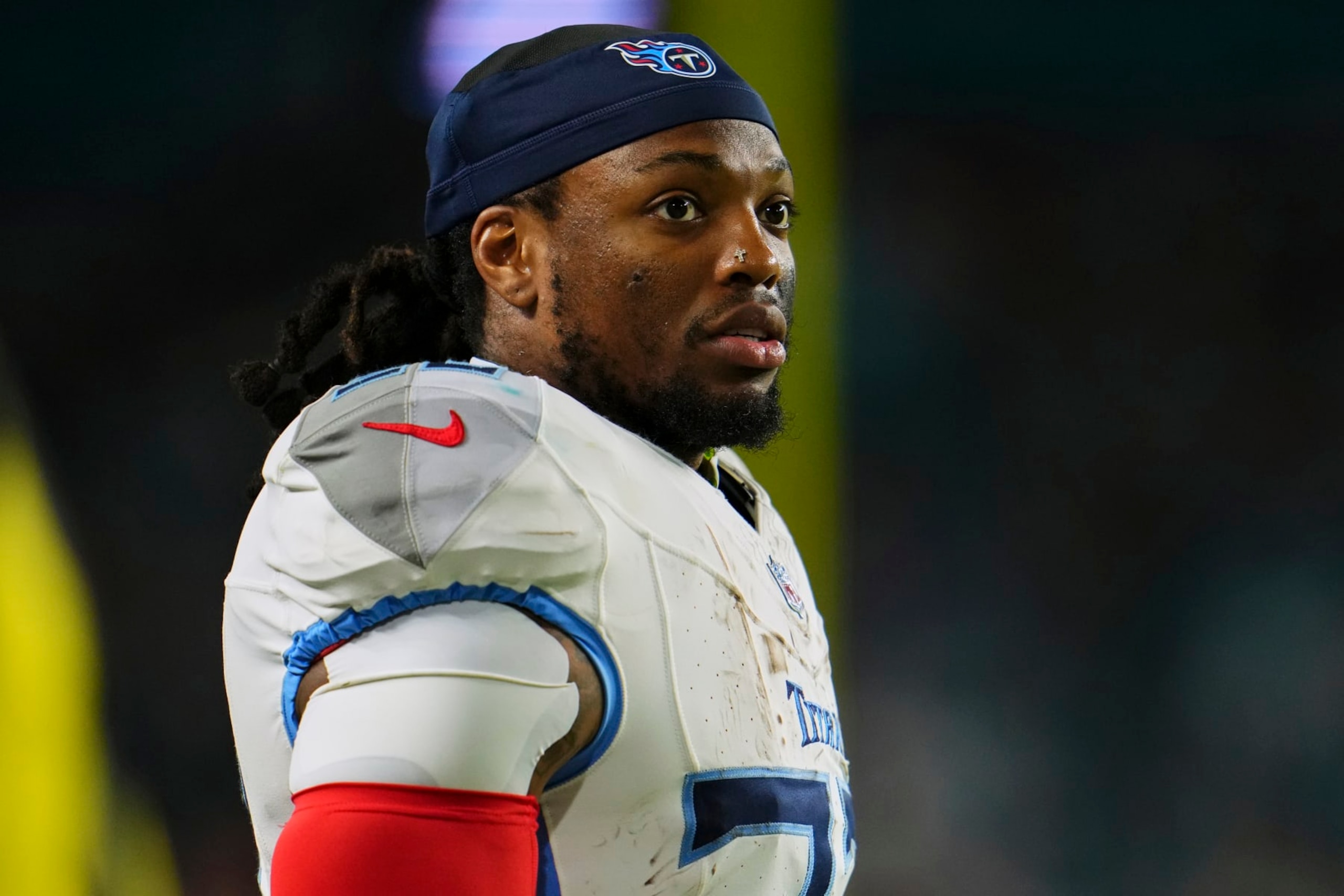 MIAMI GARDENS, FL - DECEMBER 11: Derrick Henry #22 of the Tennessee Titans looks on from the sideline against the Miami Dolphins during the first half at Hard Rock Stadium on December 11, 2023 in Miami Gardens, Florida. (Photo by Cooper Neill/Getty Images)