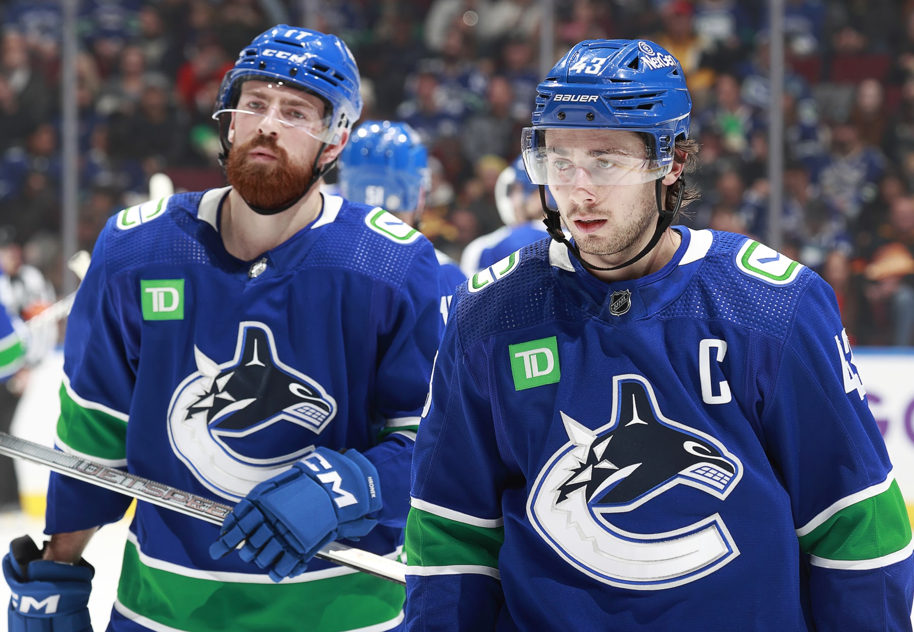 VANCOUVER, CANADA - NOVEMBER 30: Filip Hronek #17 and Quinn Hughes #43 of the Vancouver Canucks skate to the bench during their NHL game against the Vegas Golden Knights at Rogers Arena on November 30, 2023 in Vancouver, British Columbia, Canada.  (Photo by Jeff Vinnick/NHLI via Getty Images)