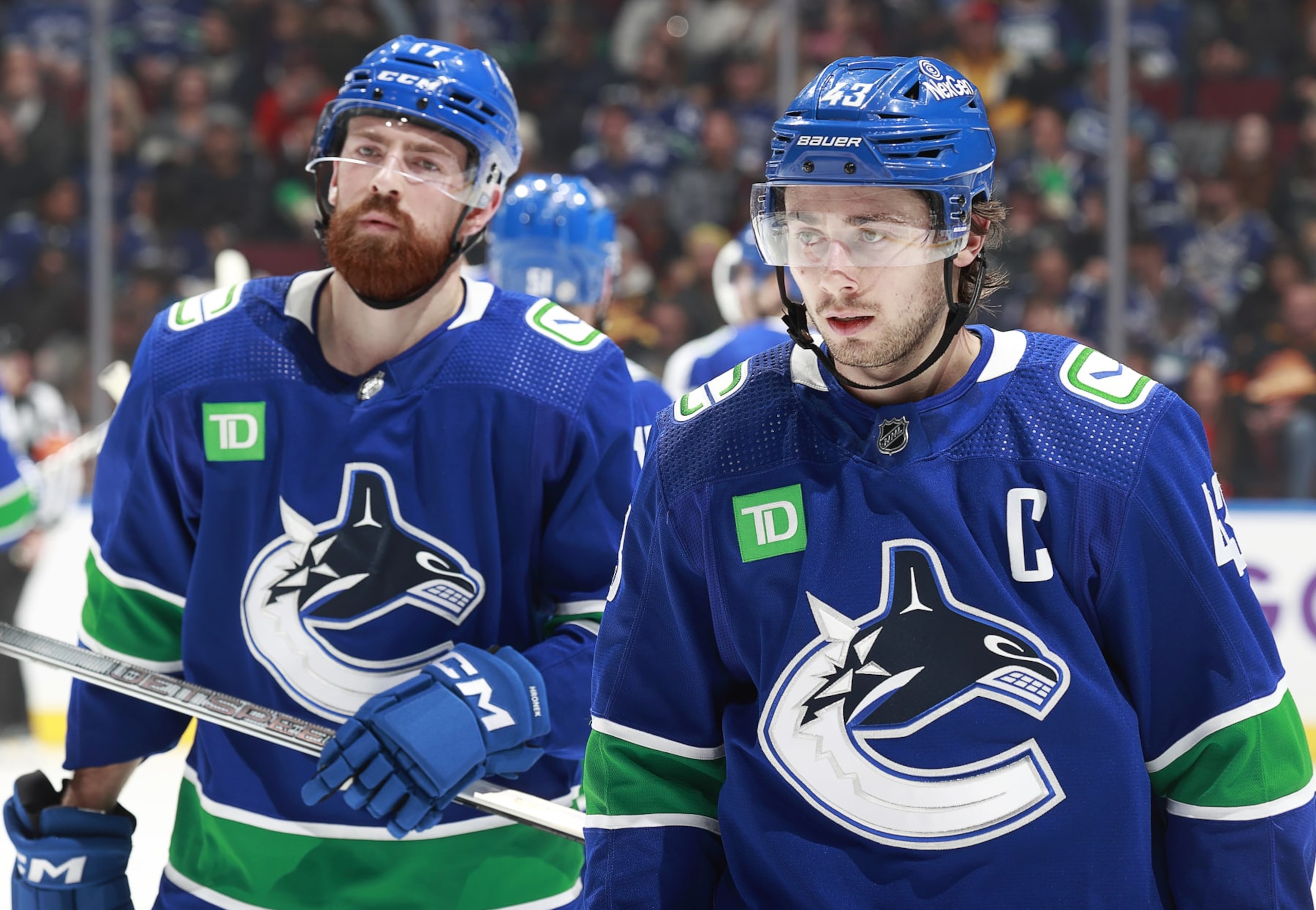 VANCOUVER, CANADA - NOVEMBER 30: Filip Hronek #17 and Quinn Hughes #43 of the Vancouver Canucks skate to the bench during their NHL game against the Vegas Golden Knights at Rogers Arena on November 30, 2023 in Vancouver, British Columbia, Canada.  (Photo by Jeff Vinnick/NHLI via Getty Images)