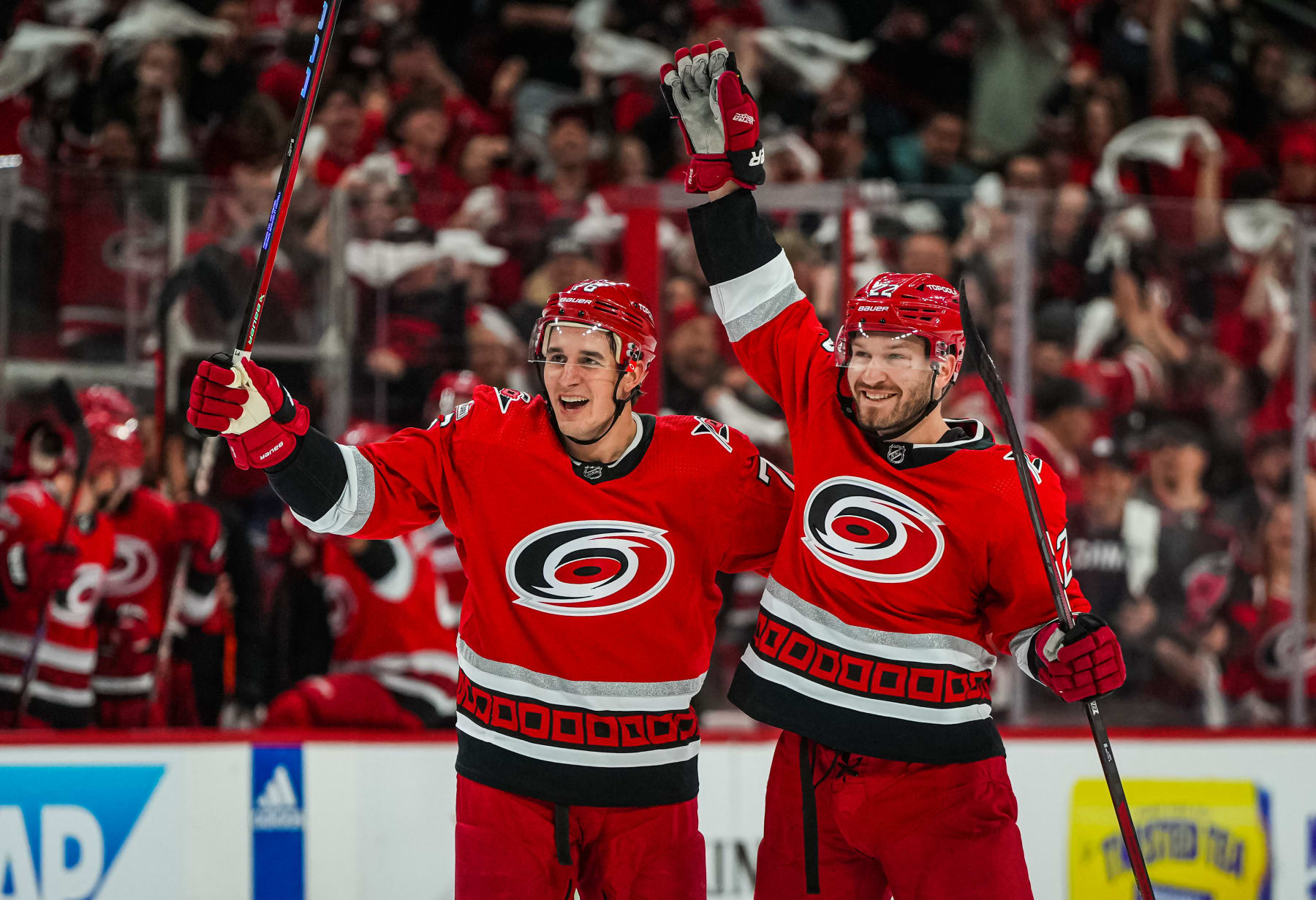 RALEIGH, NORTH CAROLINA - MAY 03: Brett Pesce #22 of the Carolina Hurricanes celebrates with Brady Skjei #76 after a goal during the first period against the New Jersey Devils in Game One of the Second Round of the 2023 Stanley Cup Playoffs at PNC Arena on May 03, 2023 in Raleigh, North Carolina. (Photo by Josh Lavallee/NHLI via Getty Images)