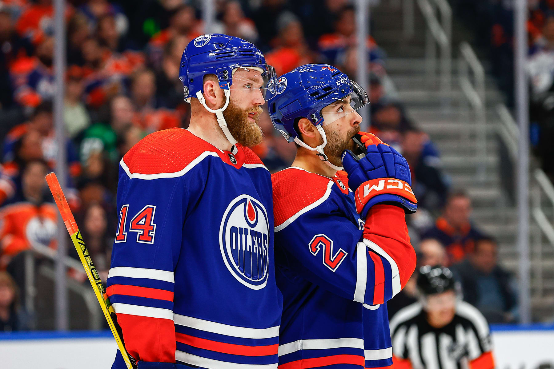 EDMONTON, AB - MARCH 16: Edmonton Oilers Defenceman Mattias Ekholm (14) and Edmonton Oilers Defenceman Evan Bouchard (2) talk about a play in the second period of the Edmonton Oilers game versus the Dallas Stars on March 16, 2023 at Rogers Place in Edmonton, AB. (Photo by Curtis Comeau/Icon Sportswire via Getty Images)