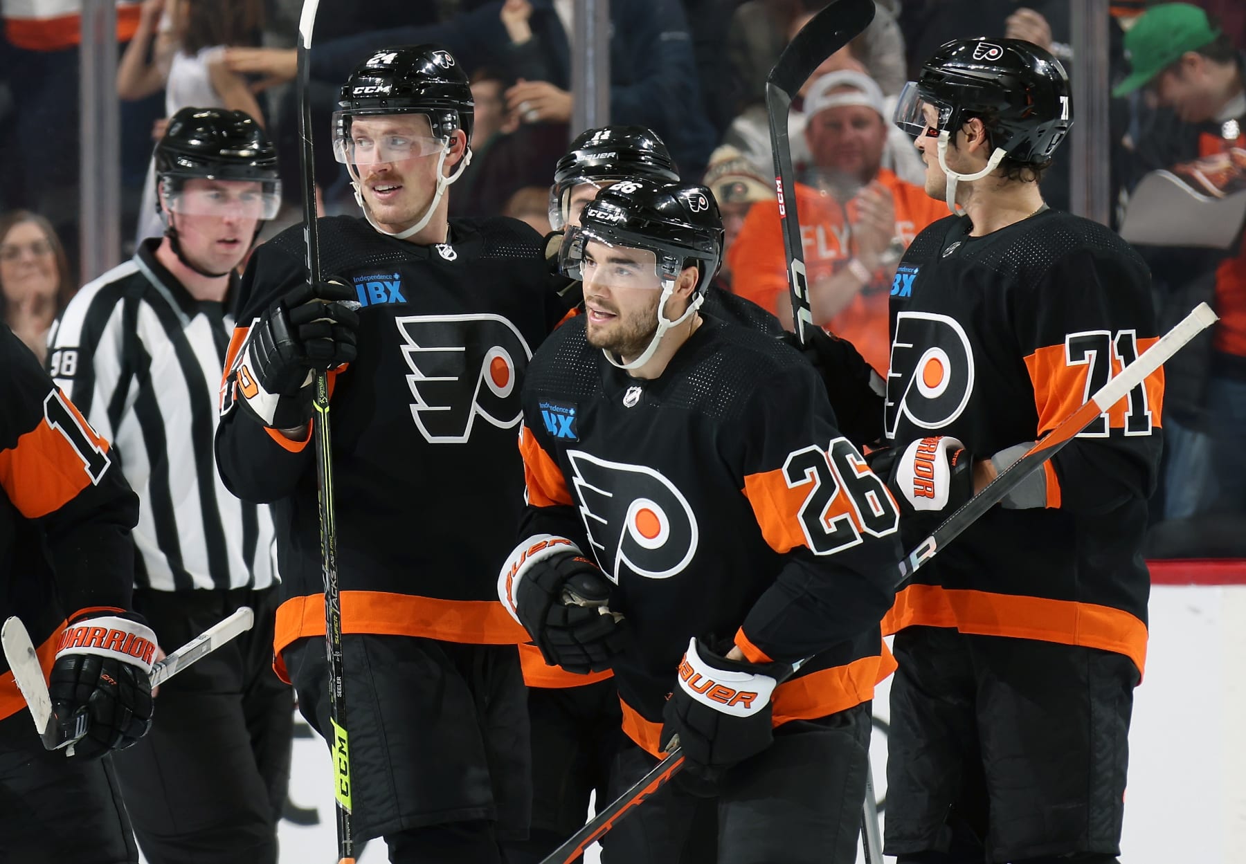 PHILADELPHIA, PENNSYLVANIA - NOVEMBER 18:  Sean Walker #26 of the Philadelphia Flyers skates towards the bench after scoring his second period goal with teammates Nick Seeler #24 and Tyson Foerster #71 against the Vegas Golden Knights at the Wells Fargo Center on November 18, 2023 in Philadelphia, Pennsylvania.  (Photo by Len Redkoles/NHLI via Getty Images)