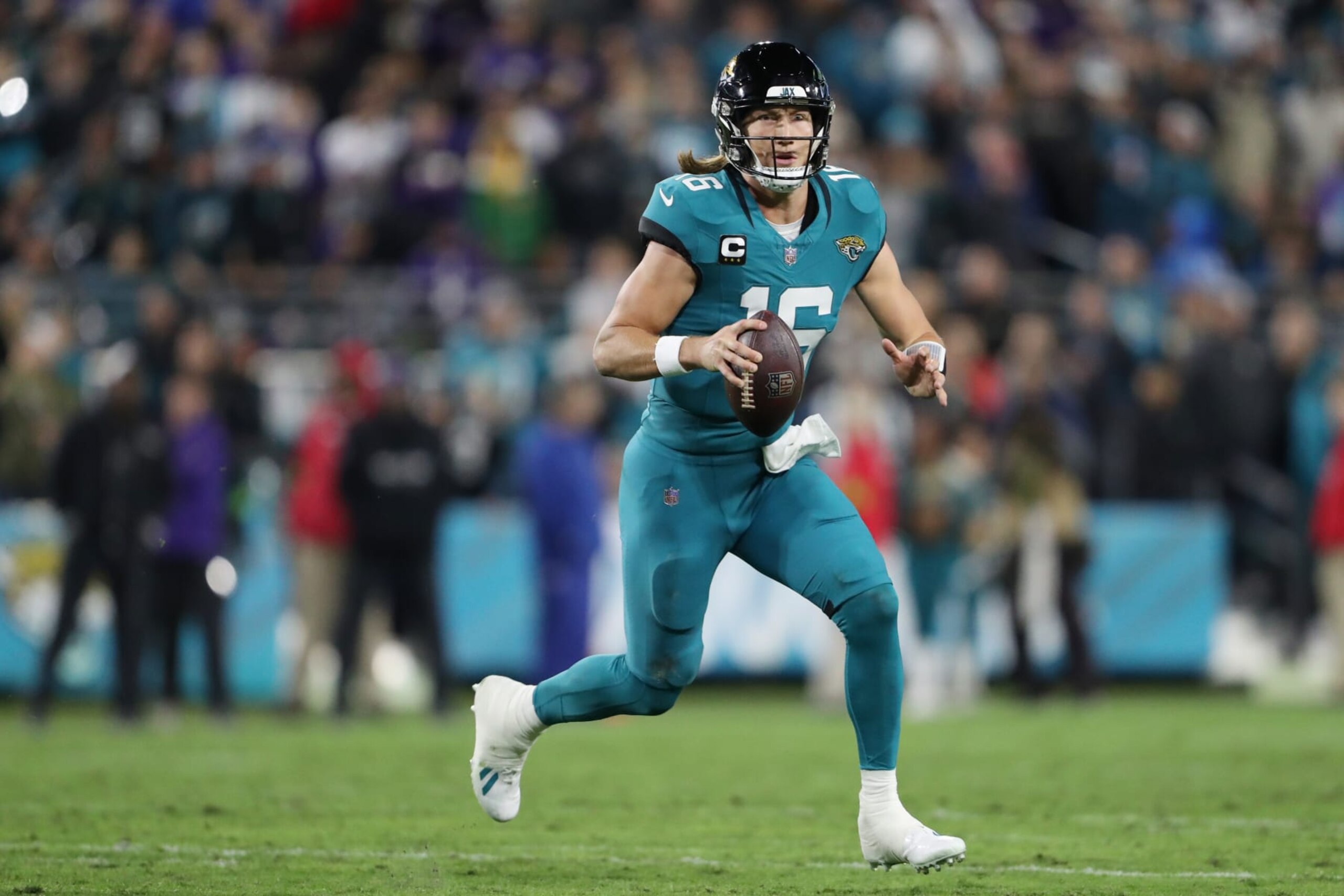 JACKSONVILLE, FLORIDA - DECEMBER 17: Trevor Lawrence #16 of the Jacksonville Jaguars looks to pass against the Baltimore Ravens during the second quarter at EverBank Stadium on December 17, 2023 in Jacksonville, Florida. (Photo by Courtney Culbreath/Getty Images)