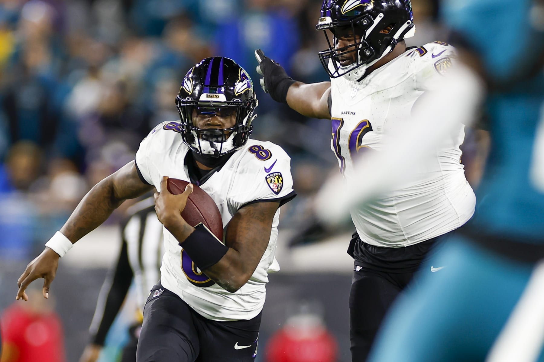 JACKSONVILLE, FL - DECEMBER 17: Baltimore Ravens quarterback Lamar Jackson (8) runs with the ball during the game between the Jacksonville Jaguars and the Baltimore Ravens on December 17, 2023 at EverBank Stadium in Jacksonville, Fl. (Photo by David Rosenblum/Icon Sportswire via Getty Images)