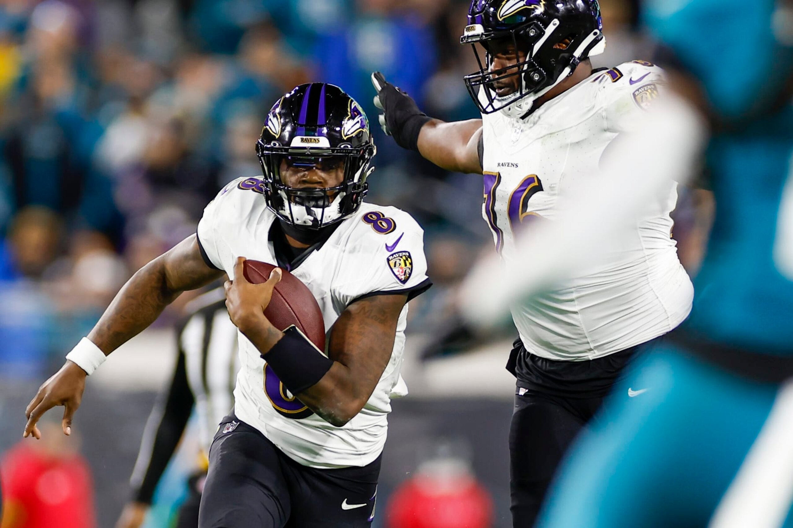 JACKSONVILLE, FL - DECEMBER 17: Baltimore Ravens quarterback Lamar Jackson (8) runs with the ball during the game between the Jacksonville Jaguars and the Baltimore Ravens on December 17, 2023 at EverBank Stadium in Jacksonville, Fl. (Photo by David Rosenblum/Icon Sportswire via Getty Images)