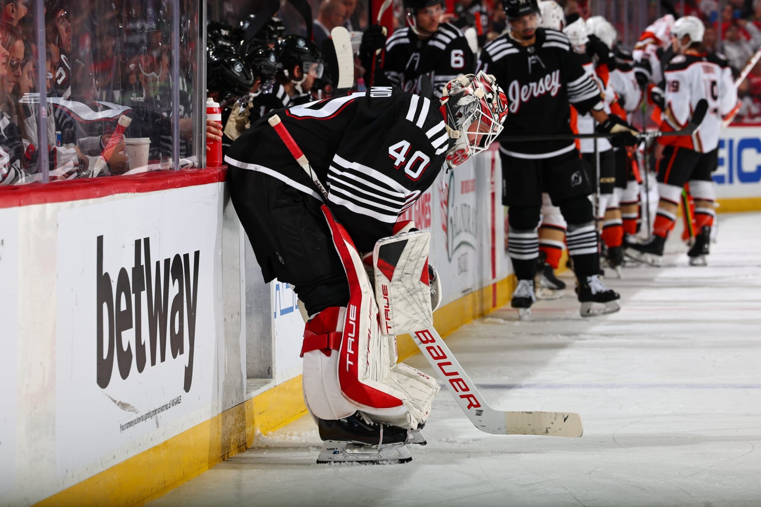 NEWARK, NJ - DECEMBER 17: Akira Schmid #40 of the New Jersey Devils skates in the second period of the game against the Anaheim Ducks at the Prudential Center on December 17, 2023 in Newark, New Jersey.  (Photo by Rich Graessle/NHLI via Getty Images)