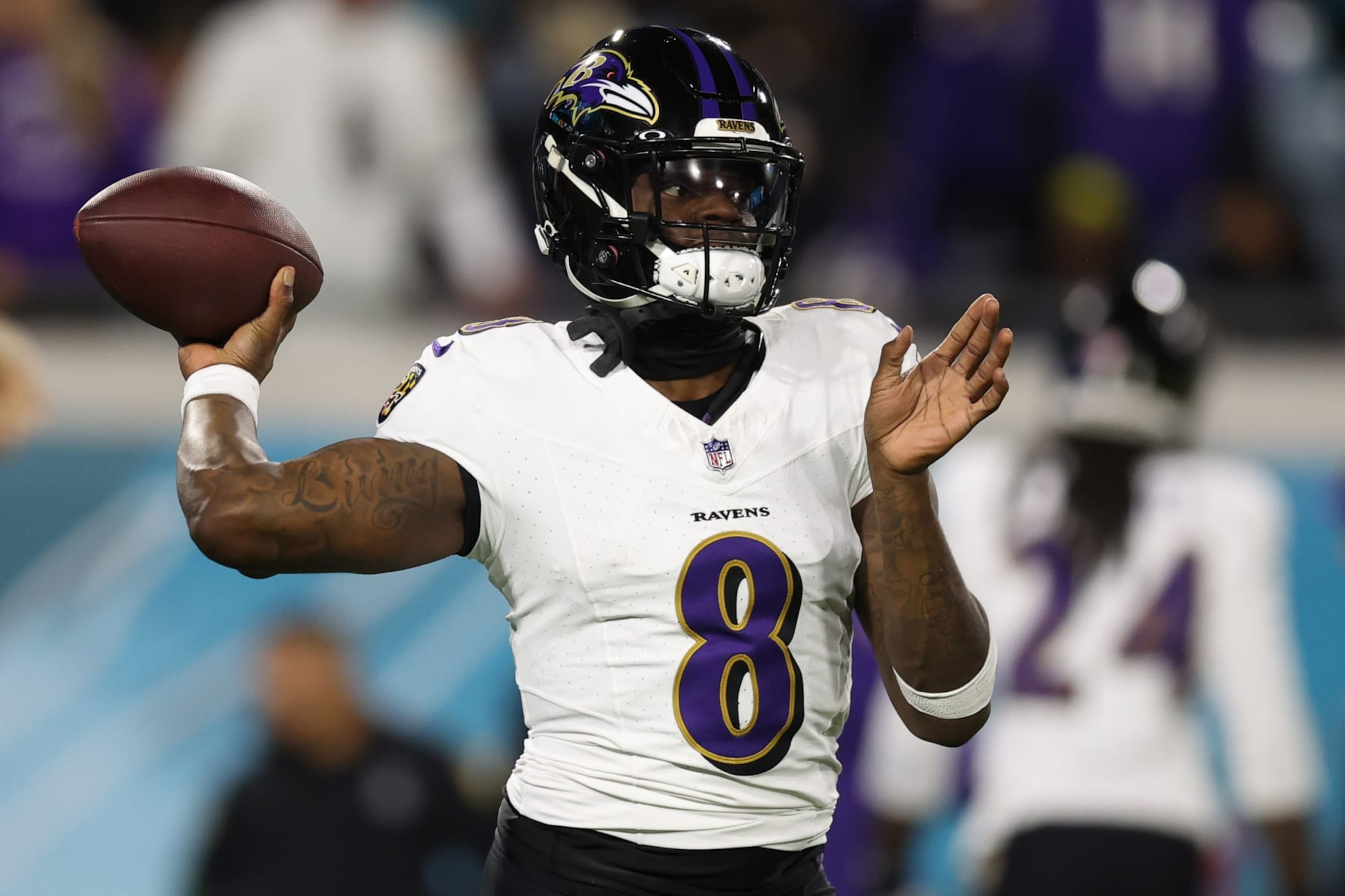 JACKSONVILLE, FLORIDA - DECEMBER 17: Lamar Jackson #8 of the Baltimore Ravens warms up before the game against the Jacksonville Jaguars at EverBank Stadium on December 17, 2023 in Jacksonville, Florida. (Photo by Mike Carlson/Getty Images)