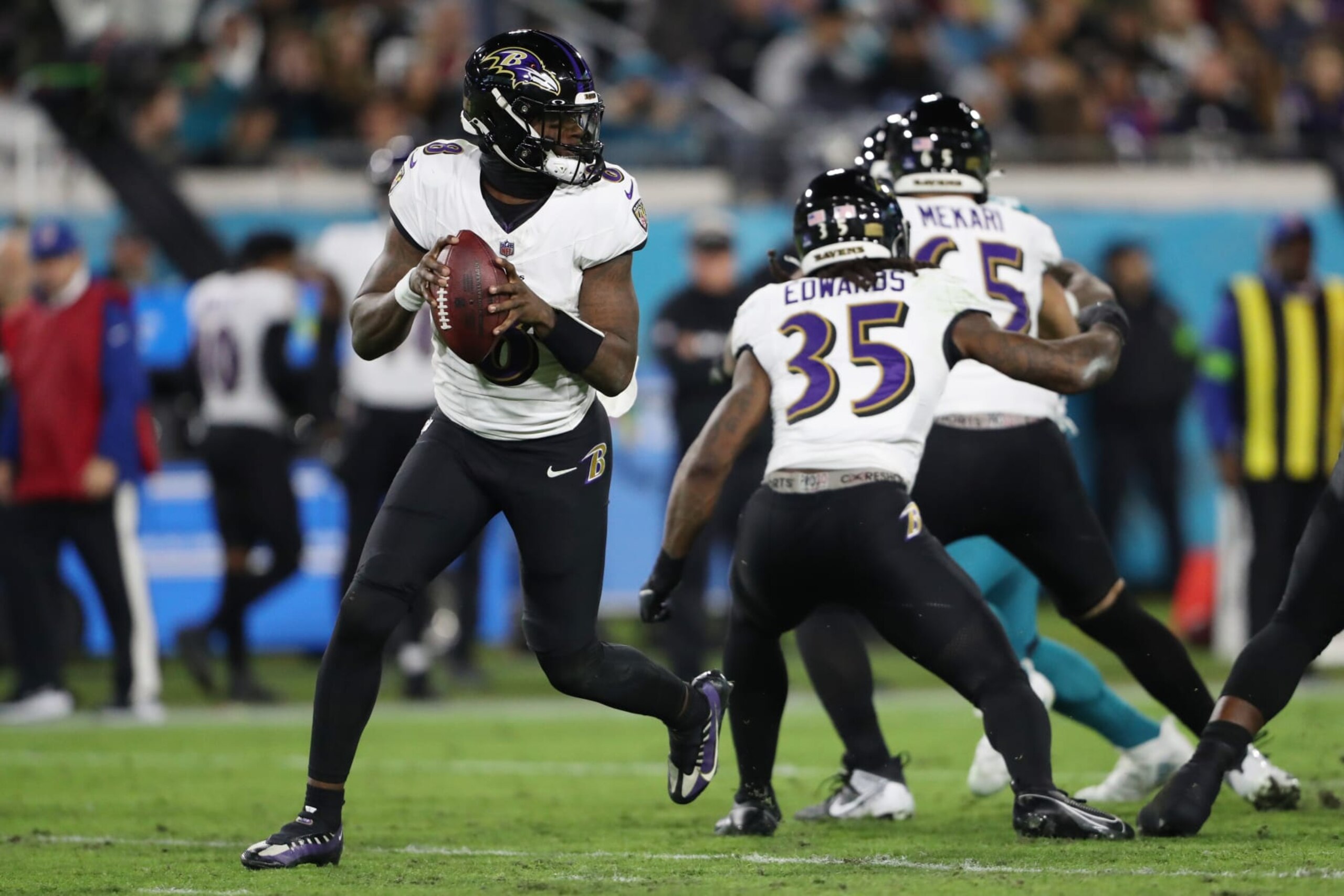 JACKSONVILLE, FLORIDA - DECEMBER 17: Lamar Jackson #8 of the Baltimore Ravens looks to pass against the Jacksonville Jaguars during the second quarter at EverBank Stadium on December 17, 2023 in Jacksonville, Florida. (Photo by Courtney Culbreath/Getty Images)