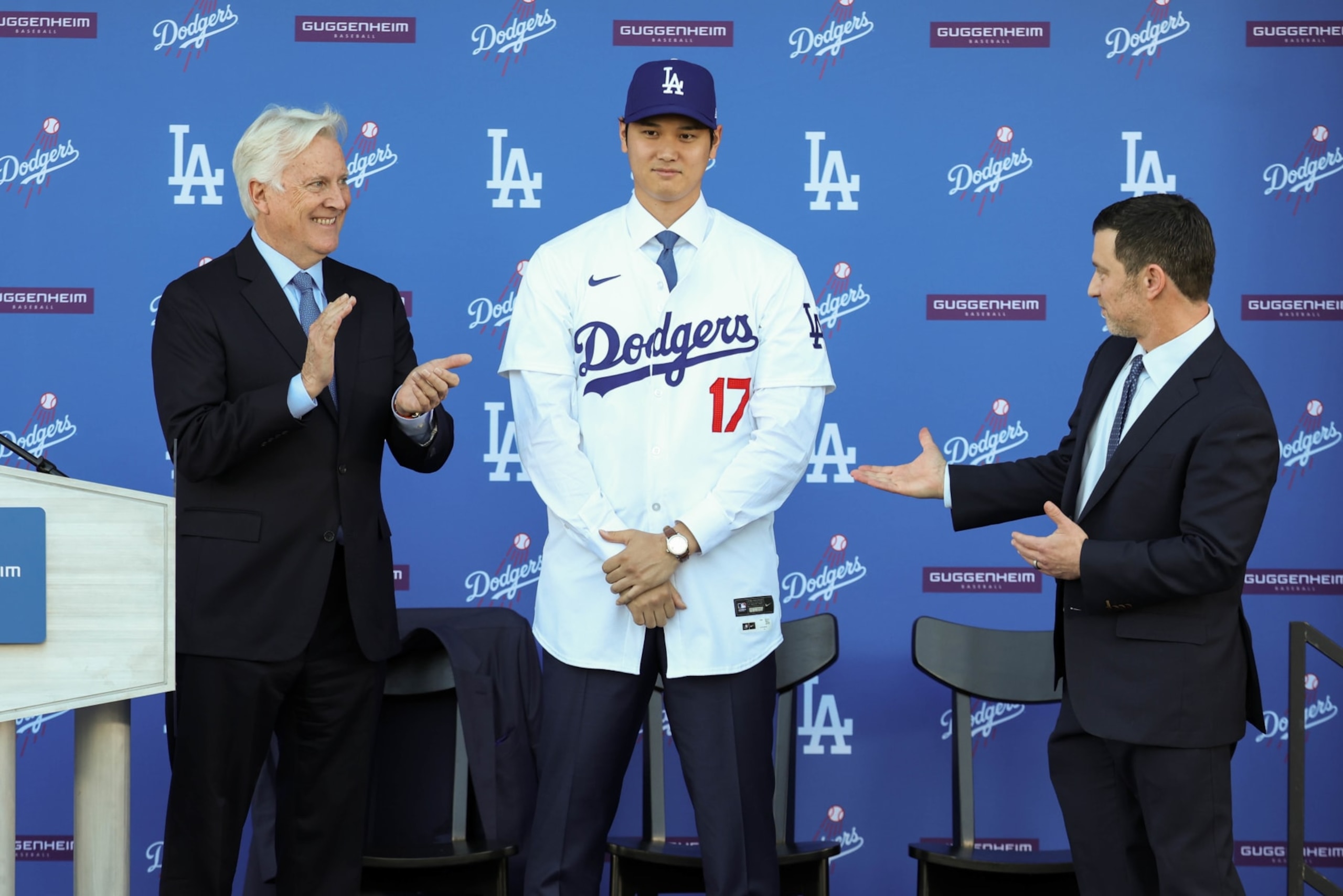 Mark Walter (L), Shohei Ohtani (C) and Andrew Friedman (R)