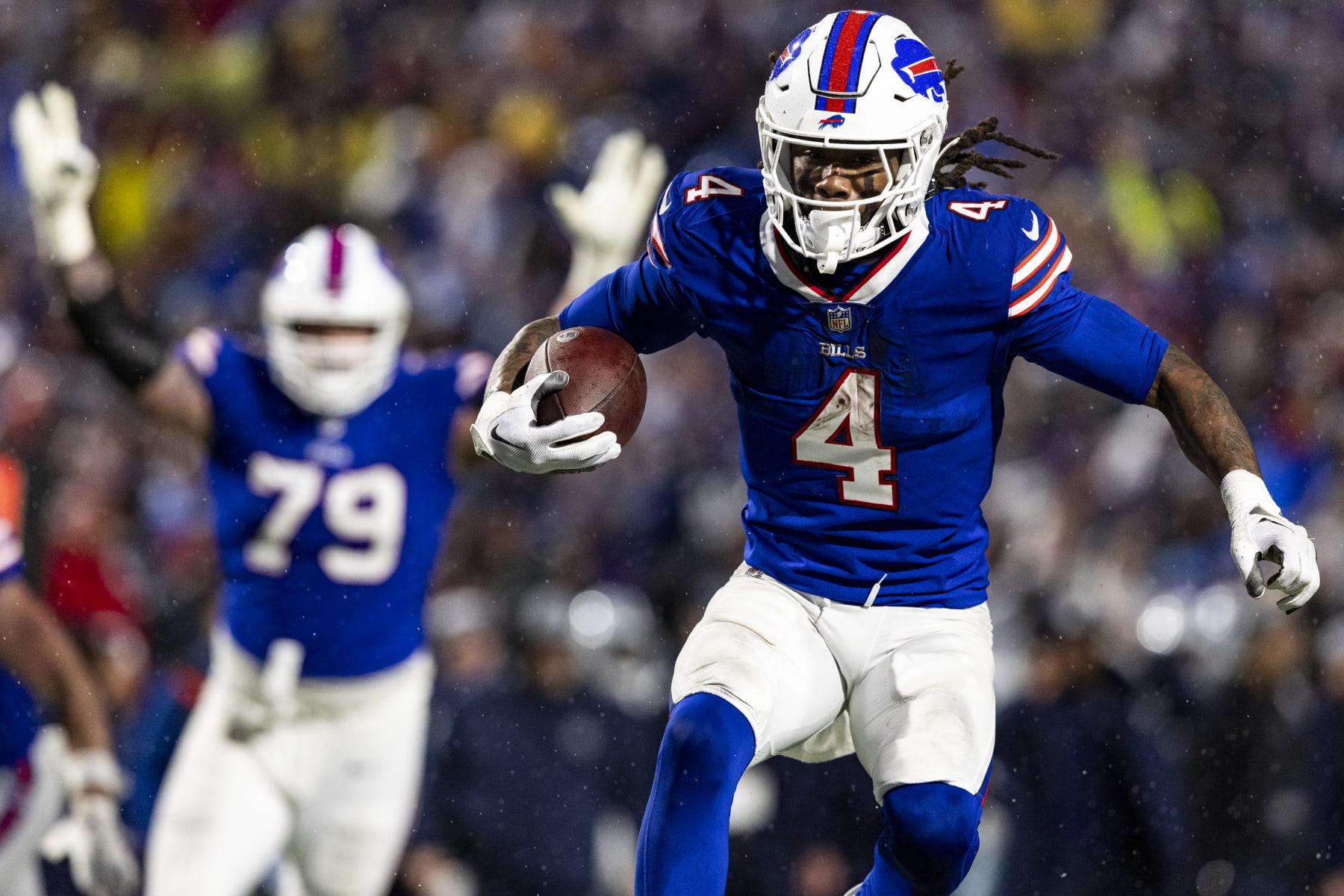 DETROIT, MICHIGAN - DECEMBER 17: James Cook #4 of the Buffalo Bills scores a touchdown during the game against the Dallas Cowboys at Highmark Stadium on December 17, 2023 in Orchard Park, New York. The Bills beat the Cowboys 31-10. (Photo by Lauren Leigh Bacho/Getty Images)