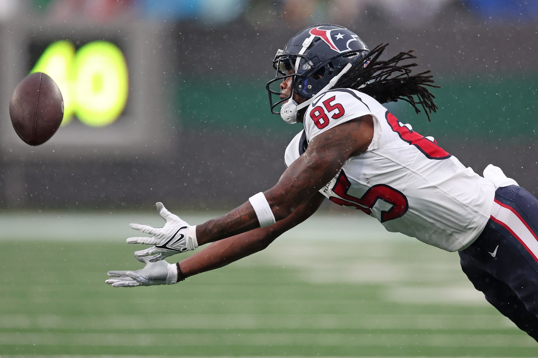 EAST RUTHERFORD, NEW JERSEY - DECEMBER 10: Noah Brown #85 of the Houston Texans attempts to make a catch during the second quarter in the game against the New York Jets at MetLife Stadium on December 10, 2023 in East Rutherford, New Jersey. (Photo by Al Bello/Getty Images)