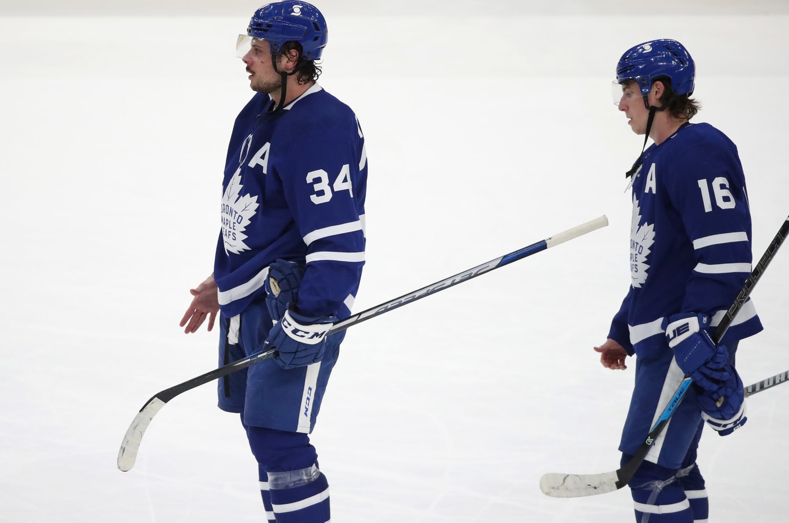 Toronto, ON- May 31  - Toronto Maple Leafs center Auston Matthews (34) and Toronto Maple Leafs center Mitchell Marner (16) line up for hand shakes as the Toronto Maple Leafs fall to the Montreal Canadiens 3-1 in game seven in the first round of the NHL play-offs at Scotiabank Arena in Toronto. May 31, 2021.        (Steve Russell/Toronto Star via Getty Images)