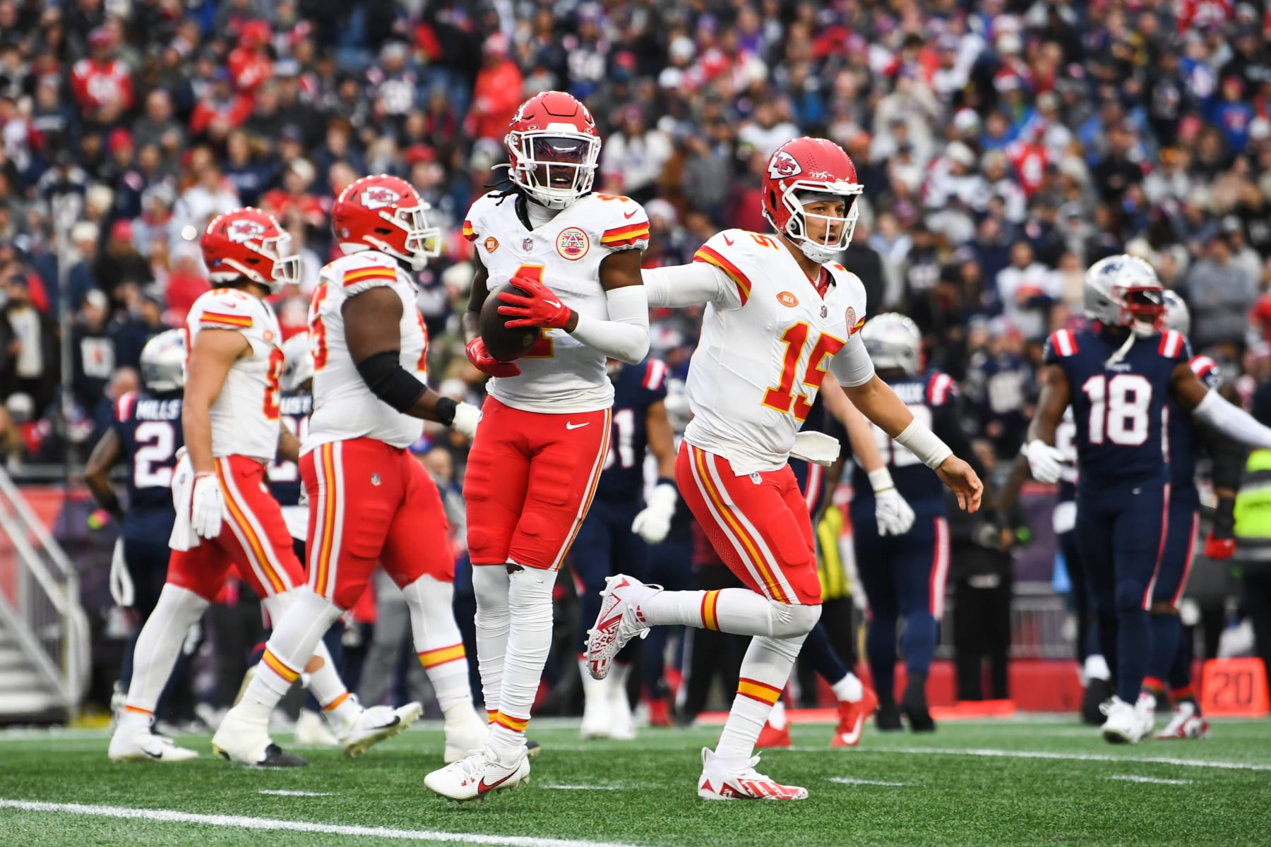FOXBORO, MA - DECEMBER 17: Rashee Rice #4 of the Kansas City Chiefs celebrates with teammates after scoring a touchdown during the first half against the New England Patriots at Gillette Stadium on December 17, 2023 in Foxboro, Massachusetts. (Photo by Kathryn Riley/Getty Images)
