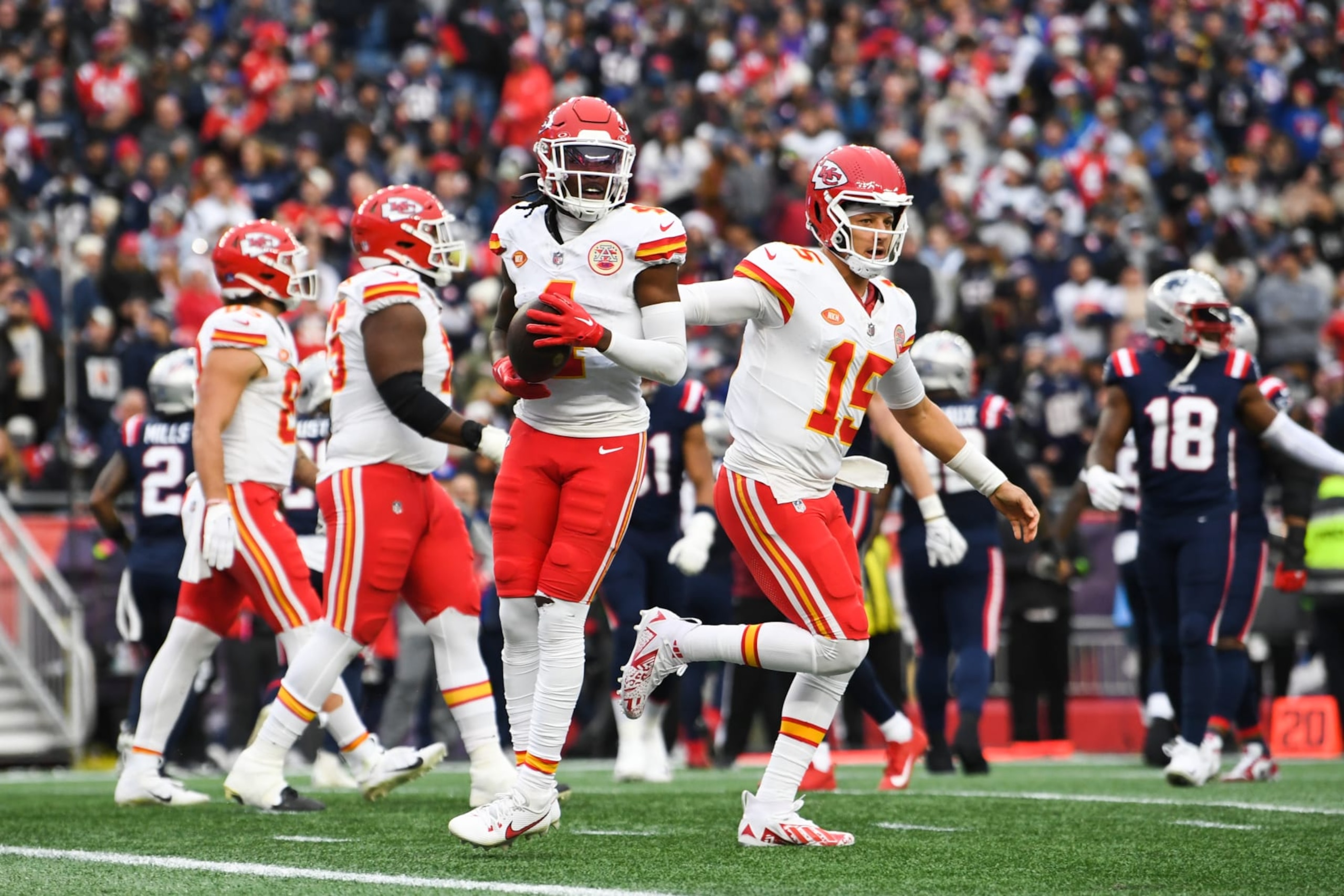 FOXBORO, MA - DECEMBER 17: Rashee Rice #4 of the Kansas City Chiefs celebrates with teammates after scoring a touchdown during the first half against the New England Patriots at Gillette Stadium on December 17, 2023 in Foxboro, Massachusetts. (Photo by Kathryn Riley/Getty Images)
