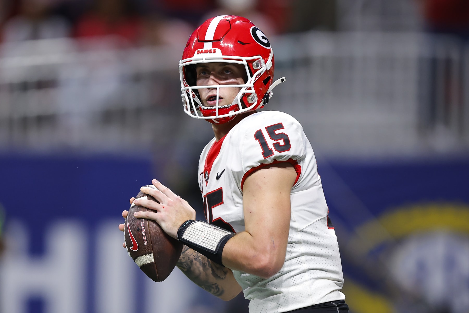 ATLANTA, GEORGIA - DECEMBER 2: Carson Beck #15 of the Georgia Bulldogs passes during the third quarter of the SEC Championship against the Alabama Crimson Tide at Mercedes-Benz Stadium on December 2, 2023 in Atlanta, Georgia. (Photo by Todd Kirkland/Getty Images)