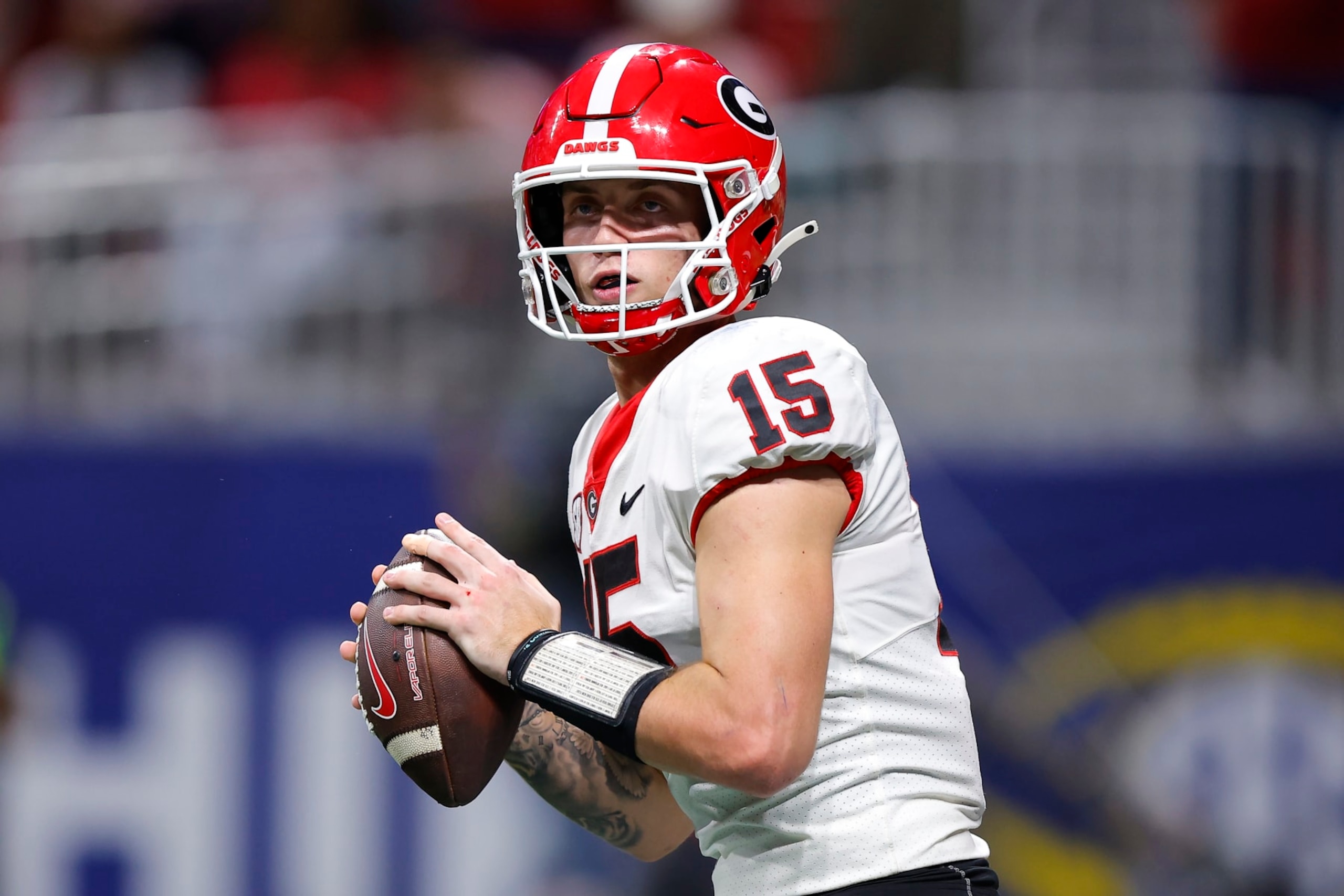 ATLANTA, GEORGIA - DECEMBER 2: Carson Beck #15 of the Georgia Bulldogs passes during the third quarter of the SEC Championship against the Alabama Crimson Tide at Mercedes-Benz Stadium on December 2, 2023 in Atlanta, Georgia. (Photo by Todd Kirkland/Getty Images)
