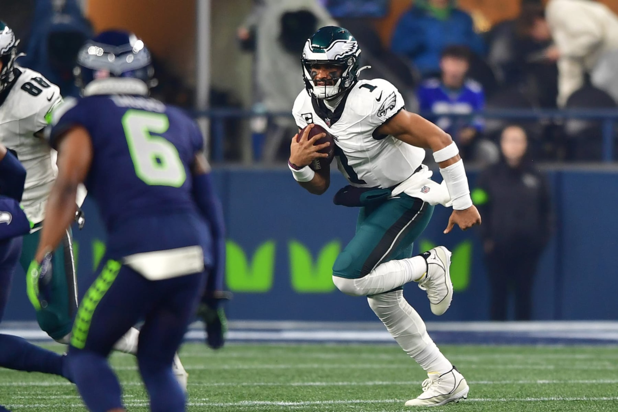 SEATTLE, WASHINGTON - DECEMBER 18: Jalen Hurts #1 of the Philadelphia Eagles runs the ball in the first quarter against the Seattle Seahawks at Lumen Field on December 18, 2023 in Seattle, Washington. (Photo by Jane Gershovich/Getty Images)