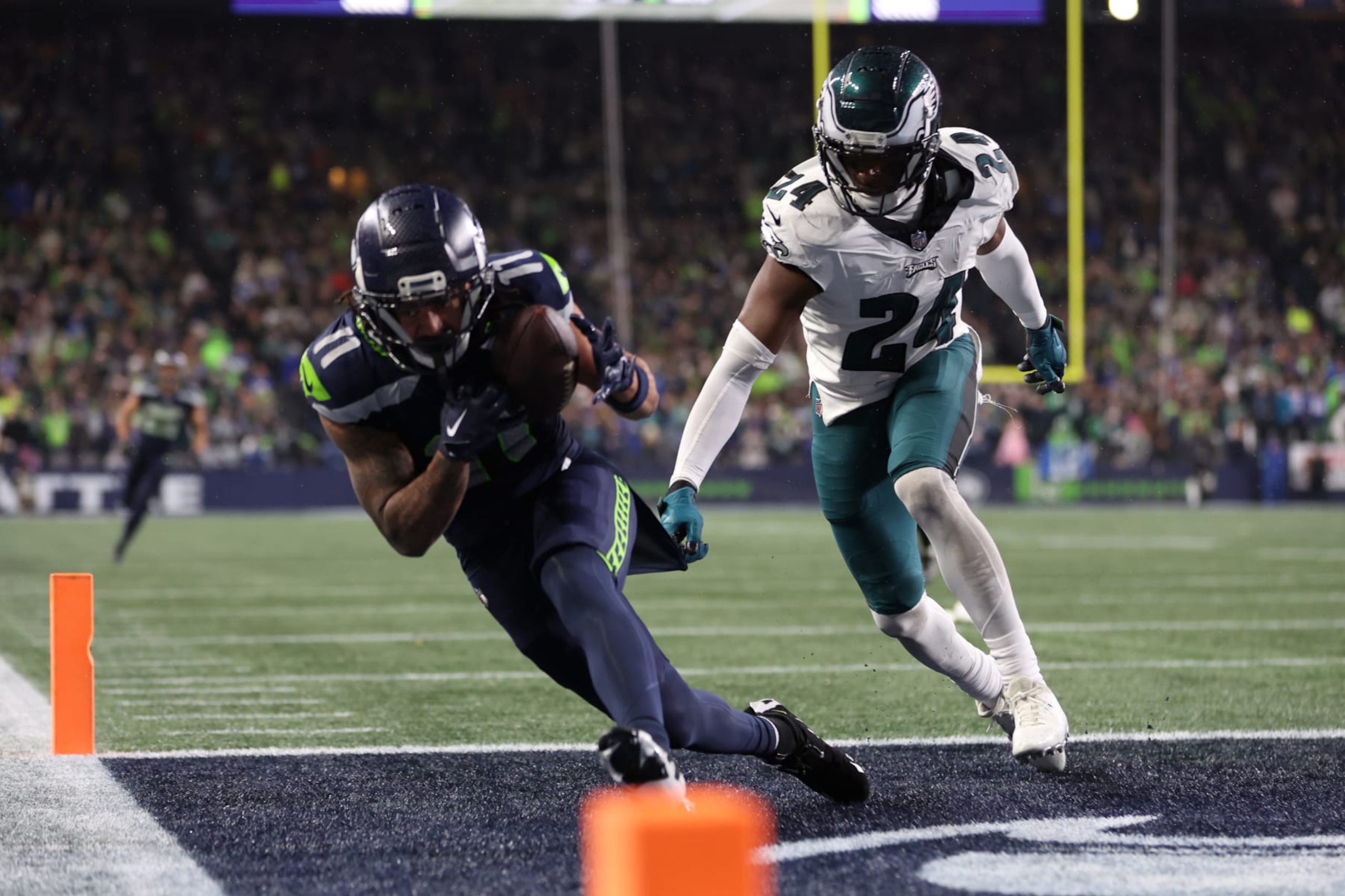 SEATTLE, WASHINGTON - DECEMBER 18: Jaxon Smith-Njigba #11 of the Seattle Seahawks catches a pass for a touchdown passed James Bradberry #24 of the Philadelphia Eagles in the fourth quarter at Lumen Field on December 18, 2023 in Seattle, Washington. (Photo by Steph Chambers/Getty Images)