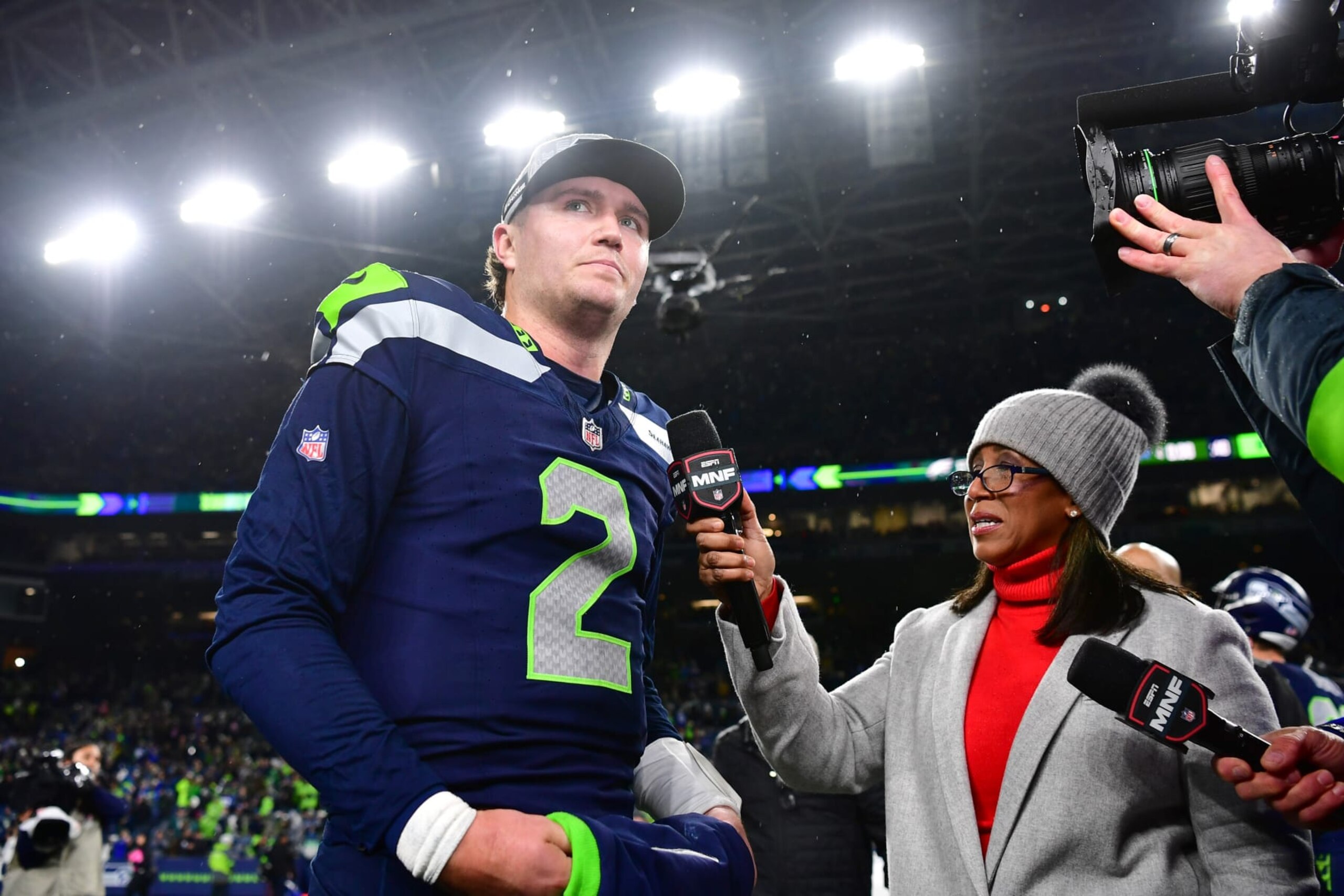 SEATTLE, WASHINGTON - DECEMBER 18: Drew Lock #2 of the Seattle Seahawks speaks to Lisa Salters at Lumen Field on December 18, 2023 in Seattle, Washington. (Photo by Jane Gershovich/Getty Images) SEATTLE, WASHINGTON - DECEMBER 18: Drew Lock #2 of the Seattle Seahawks speaks to Lisa Salters at Lumen Field on December 18, 2023 in Seattle, Washington. (Photo by Jane Gershovich/Getty Images)