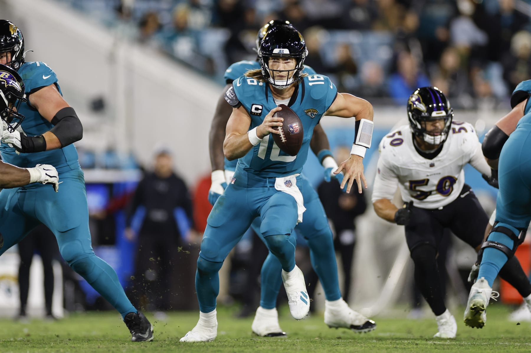 JACKSONVILLE, FL - DECEMBER 17: Jacksonville Jaguars quarterback Trevor Lawrence (16) runs with the ball during the game between the Jacksonville Jaguars and the Baltimore Ravens on December 17, 2023 at EverBank Stadium in Jacksonville, Fl. (Photo by David Rosenblum/Icon Sportswire via Getty Images)