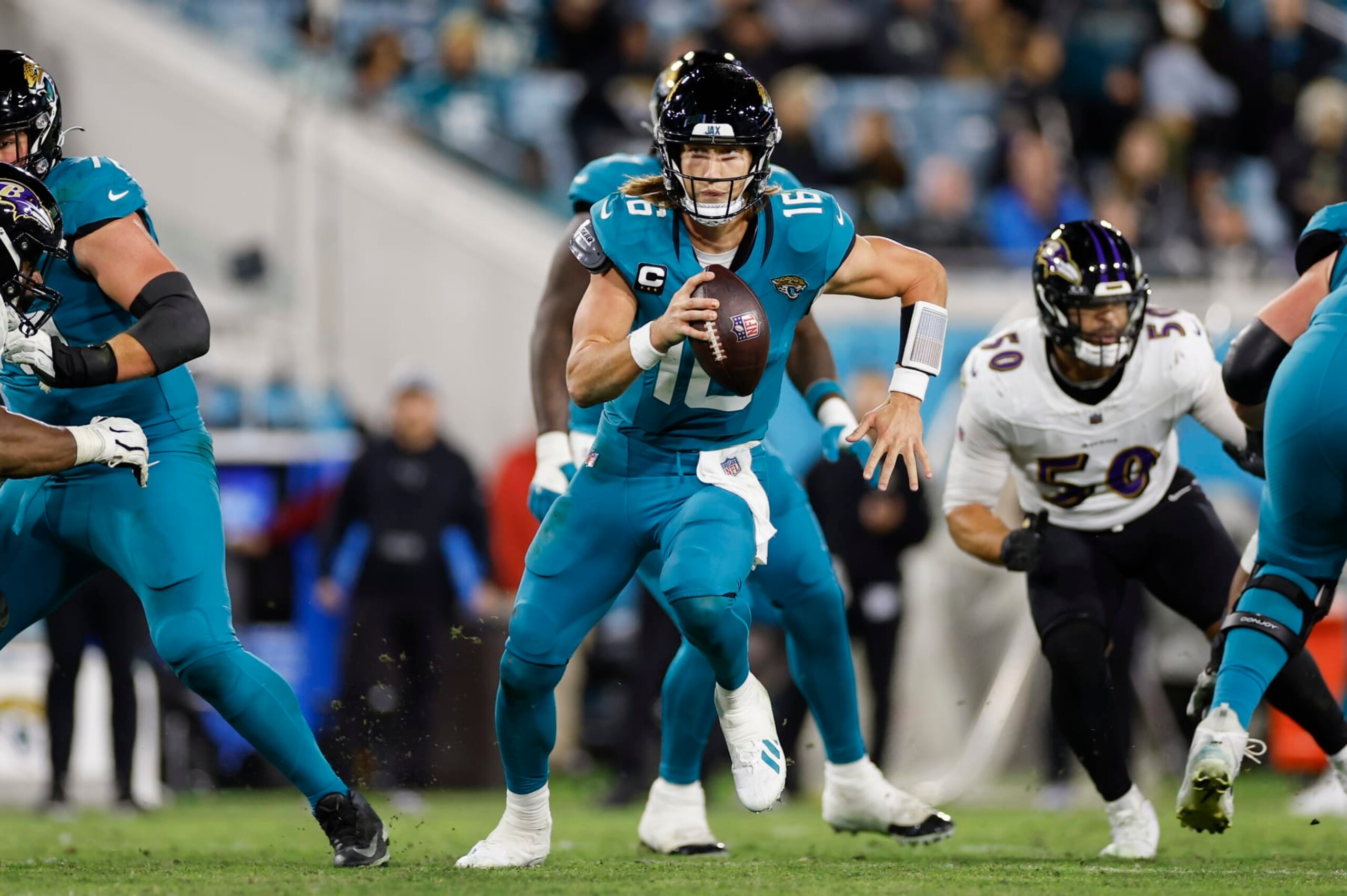JACKSONVILLE, FL - DECEMBER 17: Jacksonville Jaguars quarterback Trevor Lawrence (16) runs with the ball during the game between the Jacksonville Jaguars and the Baltimore Ravens on December 17, 2023 at EverBank Stadium in Jacksonville, Fl. (Photo by David Rosenblum/Icon Sportswire via Getty Images)