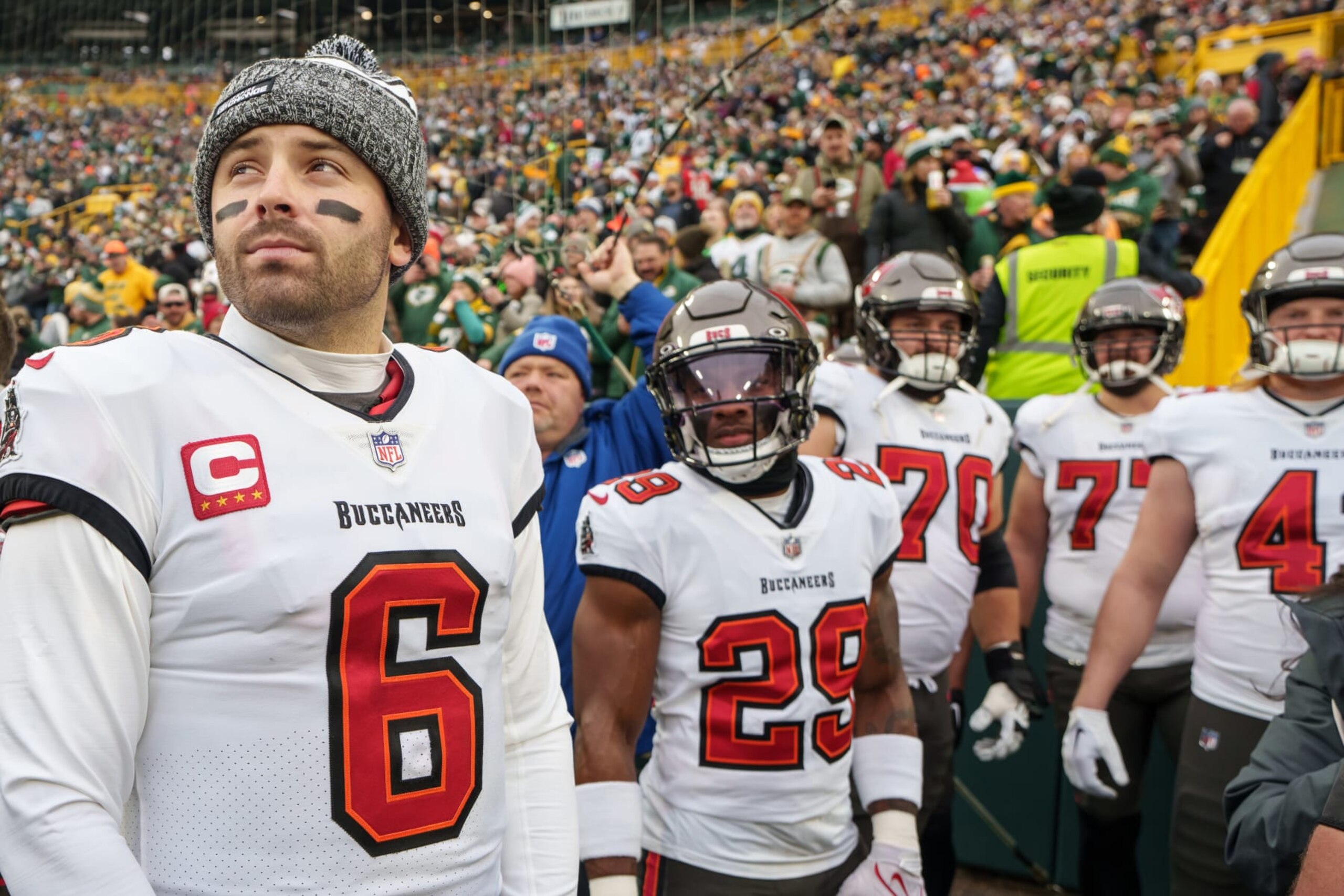 GREEN BAY, WISCONSIN - DECEMBER 17: Quarterback Baker Mayfield #6 of the Tampa Bay Buccaneers, safety Christian Izien #29 looks on during the National Anthem prior to an NFL football game against the Green Bay Packers at Lambeau Field on December 17, 2023 in Green Bay, Wisconsin. (Photo by Todd Rosenberg/Getty Images)