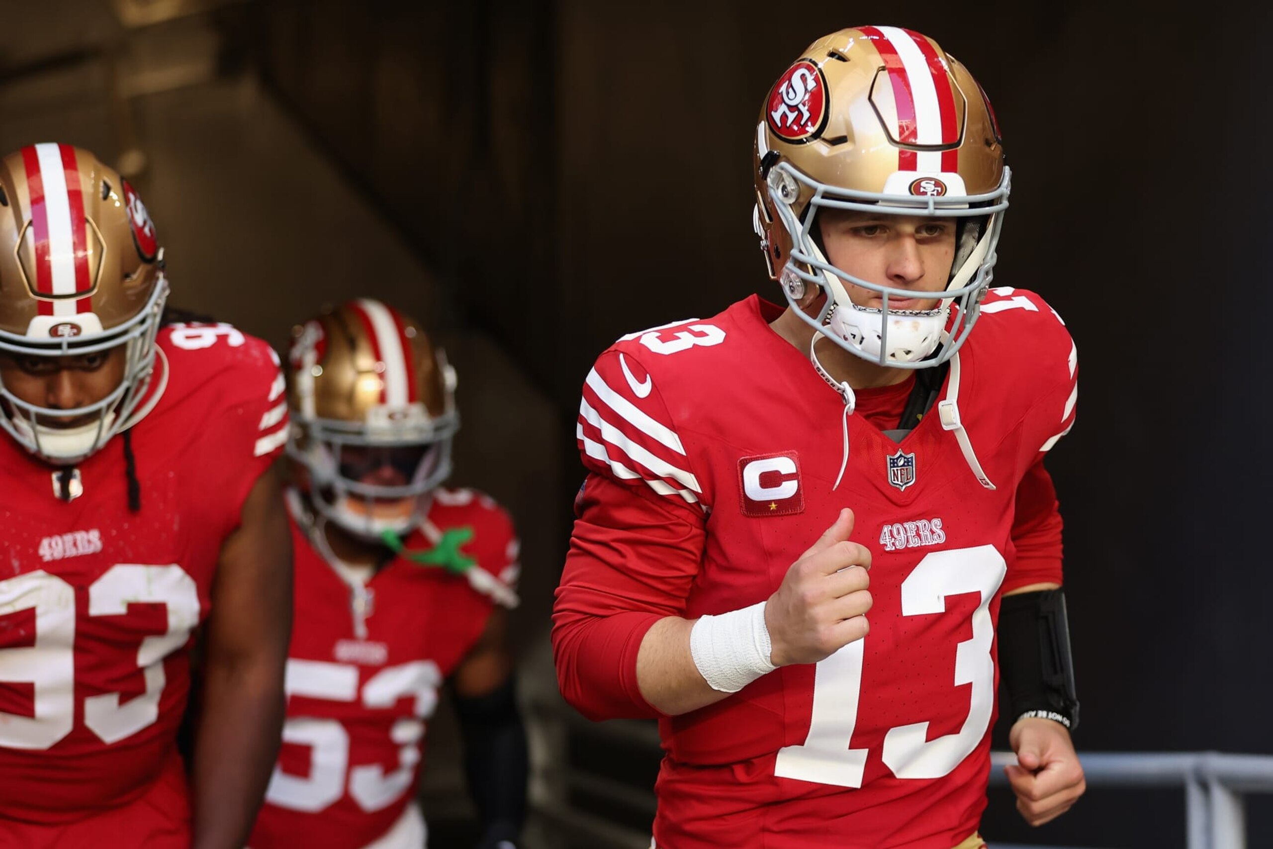 GLENDALE, ARIZONA - DECEMBER 17: Quarterback Brock Purdy #13 of the San Francisco 49ers walks out to the field during the third quarter of the NFL game against the Arizona Cardinals at State Farm Stadium on December 17, 2023 in Glendale, Arizona. The 49ers defeated the Cardinals 45-29.  (Photo by Christian Petersen/Getty Images)