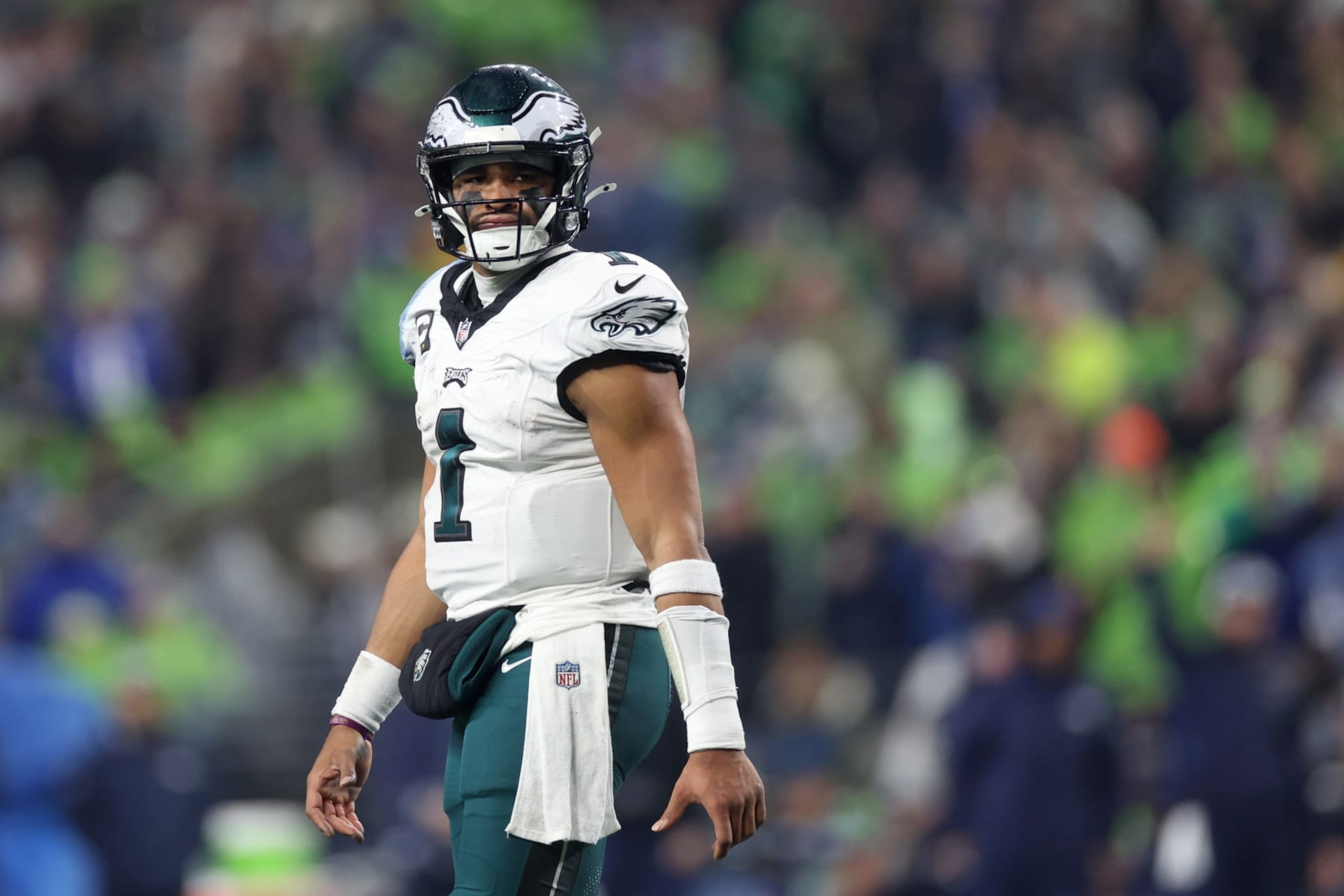 SEATTLE, WASHINGTON - DECEMBER 18: Jalen Hurts #1 of the Philadelphia Eagles looks on in the first half at Lumen Field on December 18, 2023 in Seattle, Washington. (Photo by Steph Chambers/Getty Images)