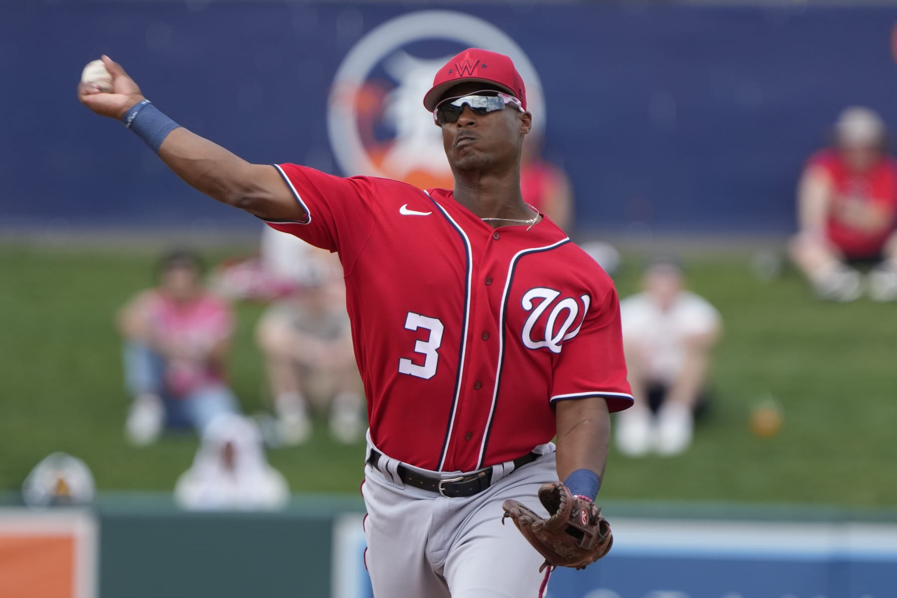Washington Nationals second baseman Jeter Downs (3) throws to first base during a spring training baseball game against the Detroit Tigers, Wednesday, March 8, 2023, in Lakeland, Fla. (AP Photo/John Raoux)