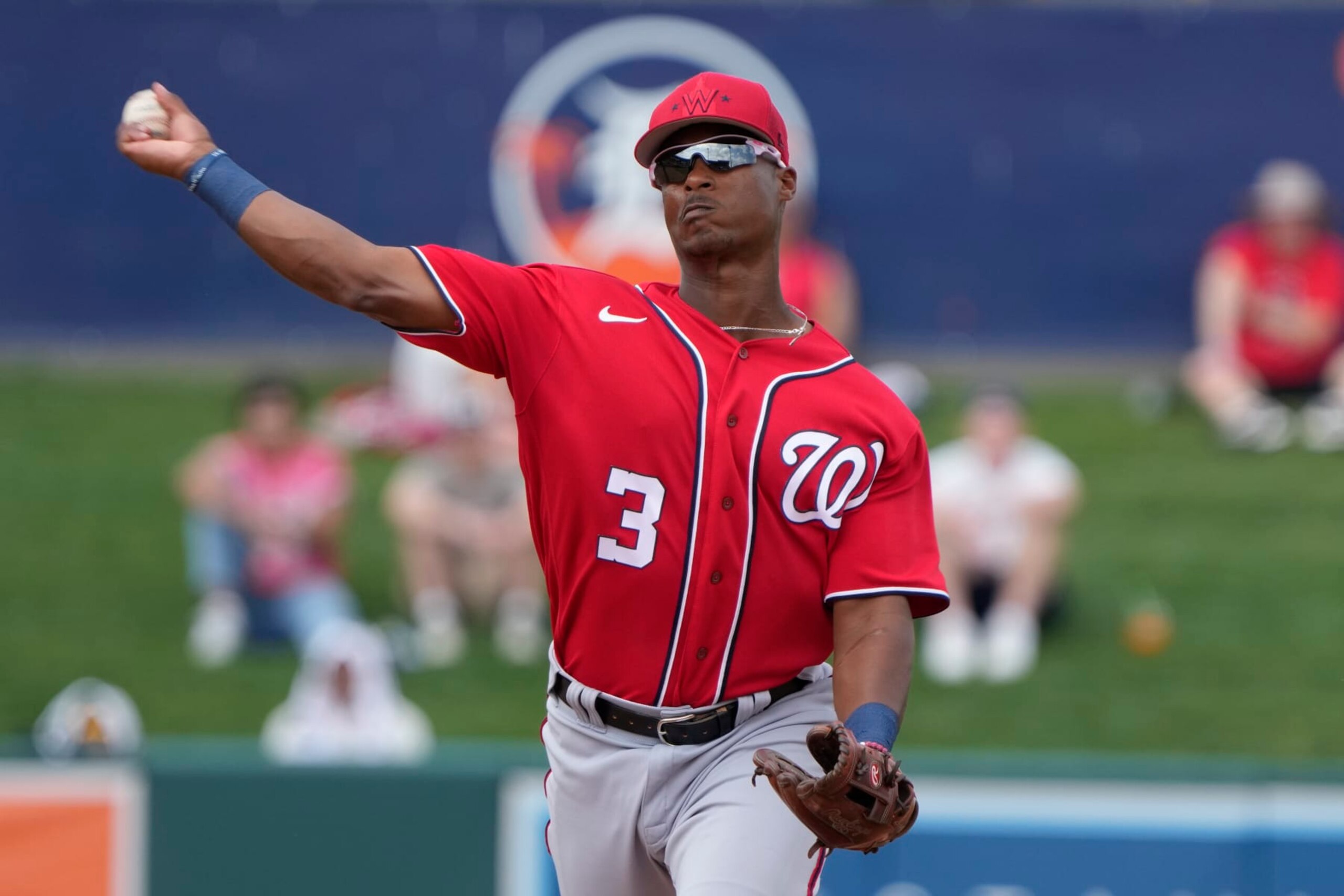 Washington Nationals second baseman Jeter Downs (3) throws to first base during a spring training baseball game against the Detroit Tigers, Wednesday, March 8, 2023, in Lakeland, Fla. (AP Photo/John Raoux)
